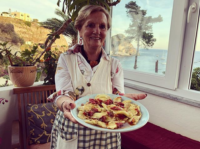Giovanna presenting her finished ravioli dressed with a sauce made from prawn heads (the prawns are the main course). The eggs to make her pasta come from her chickens, who surely have a coop with the best view in the world (see second pic). No photo
