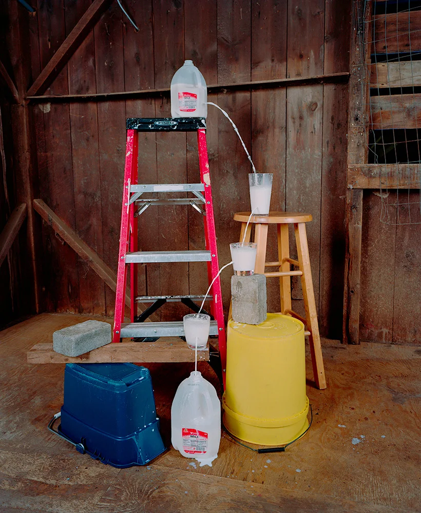TRANSFERRING A GALLON OF MILK FROM ONE CONTAINER TO ANOTHER
