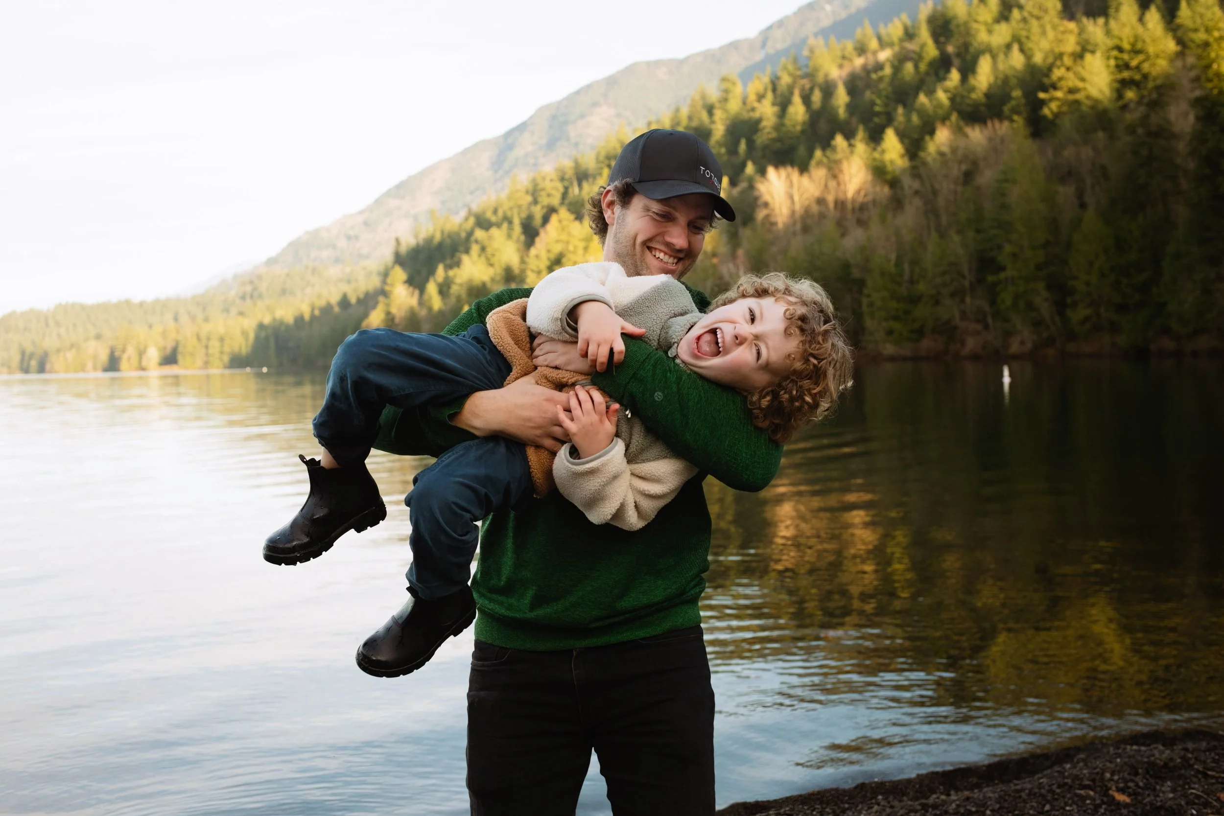 Dad and son laugh and play cultus lake photo