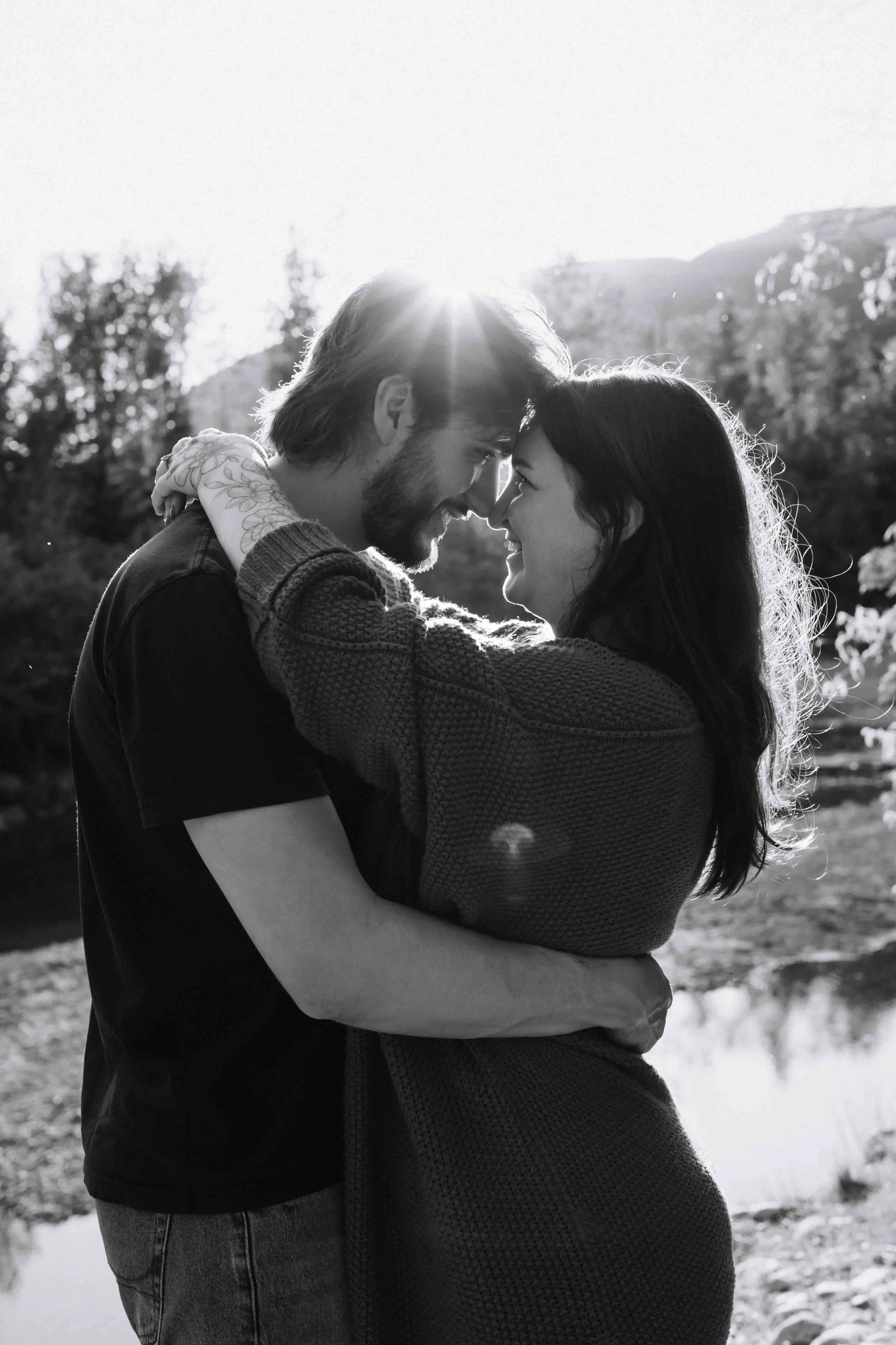 Vancouver couple romantically gets cozy with arms around each other and foreheads tenderly pressed together