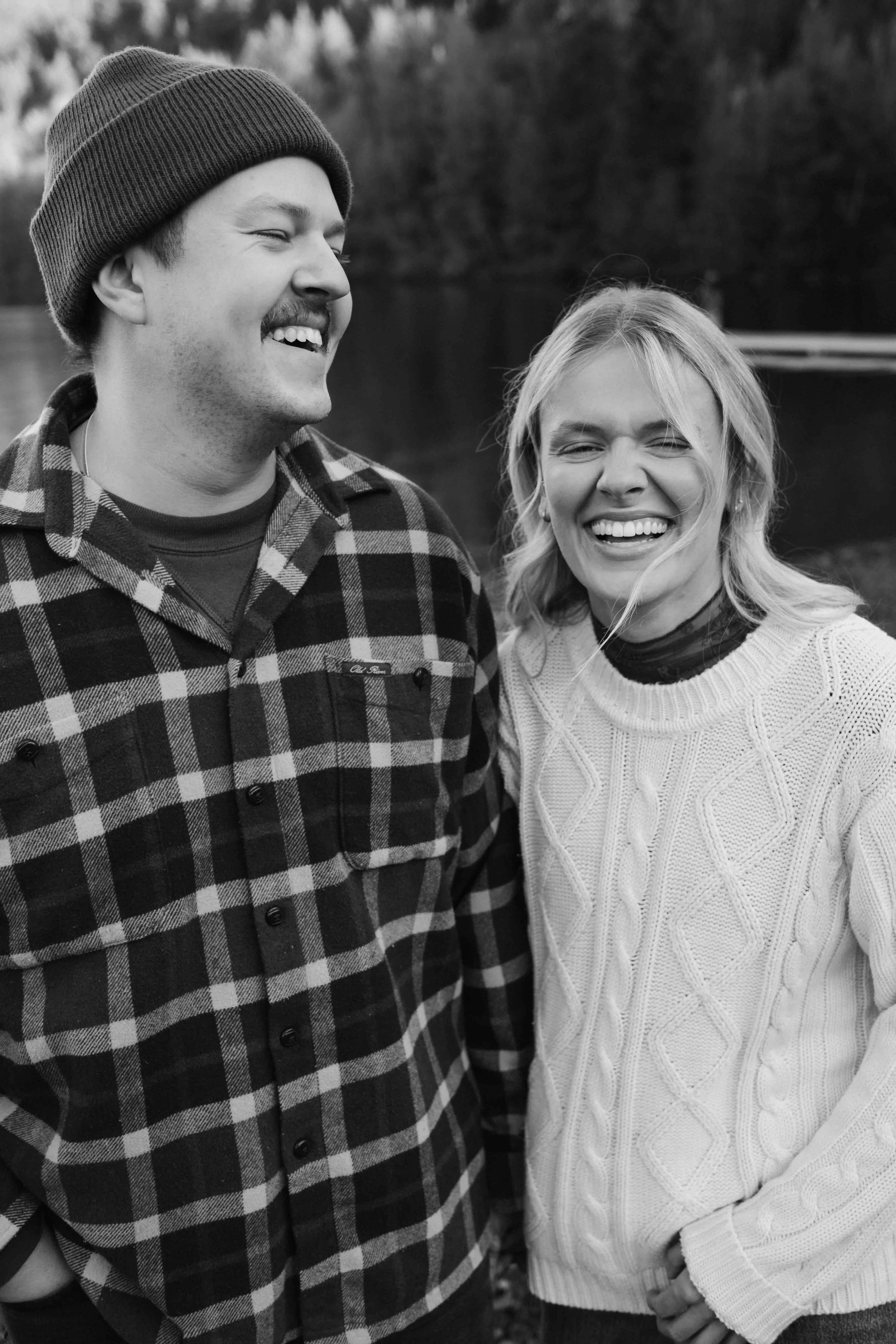 Outdoorsy adventure Vancouver couple laughing side by side