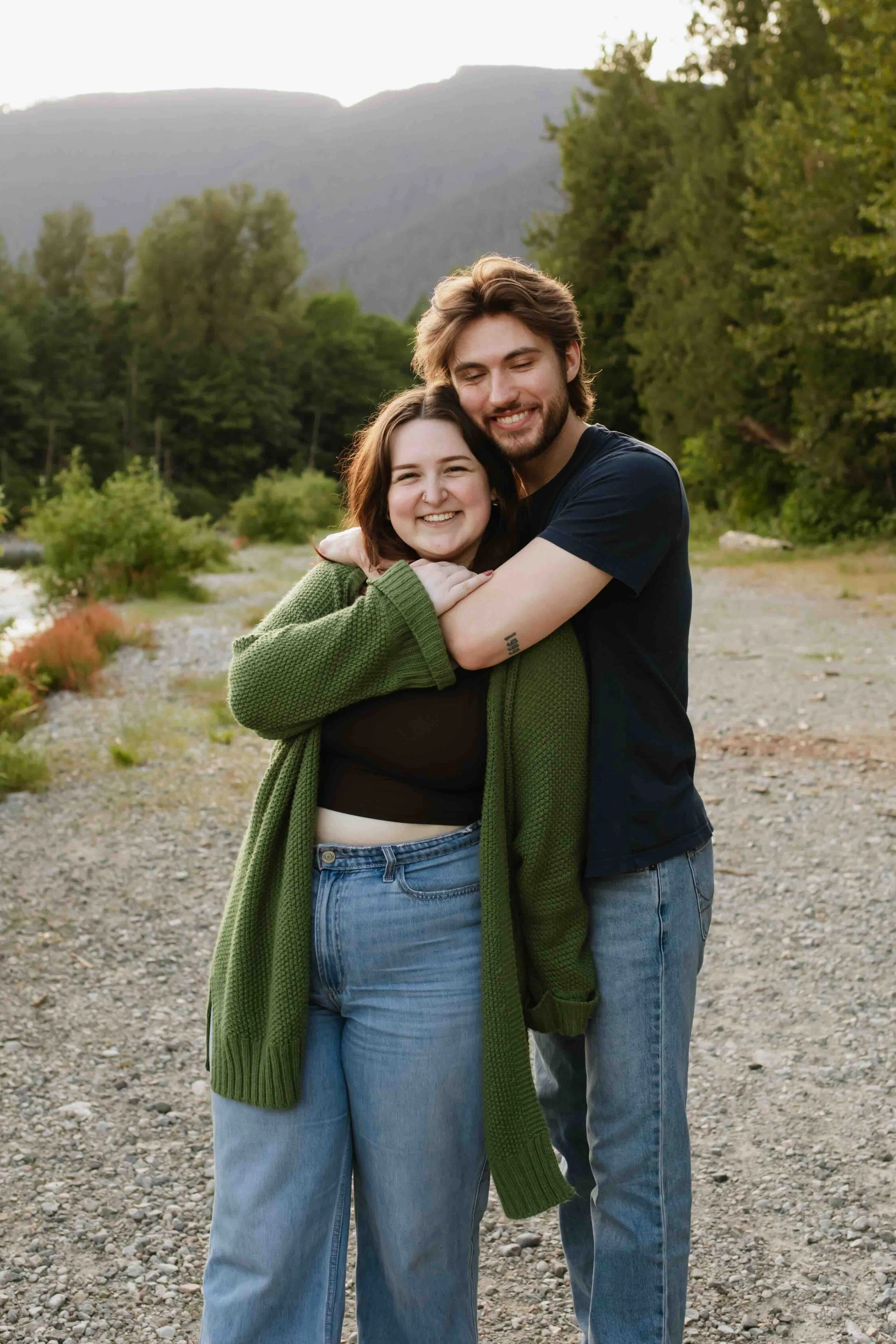 Vancouver man hugs fiancee from behind with stunning mountain view