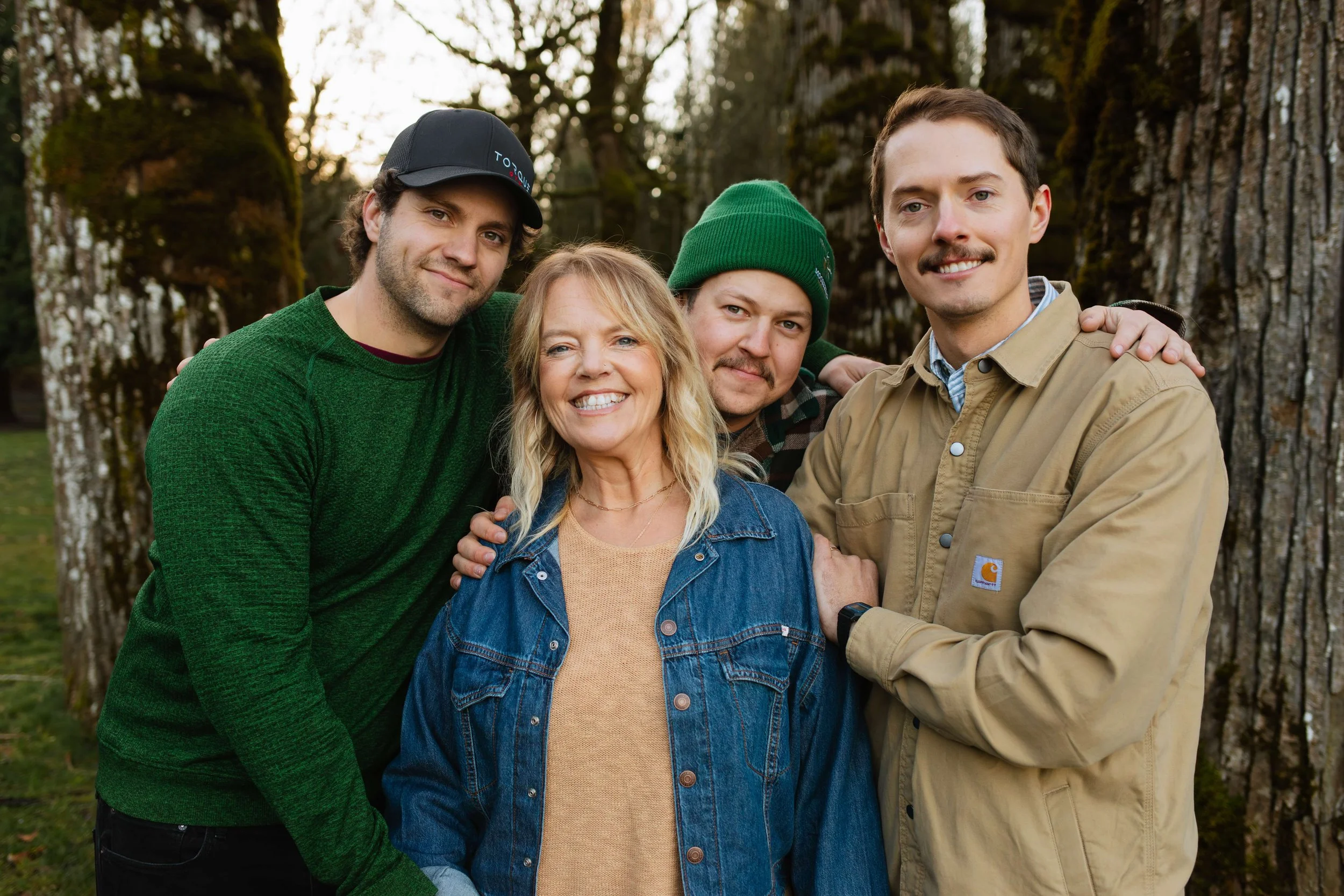 PNW outdoorsy family photos mom smiles with adult sons