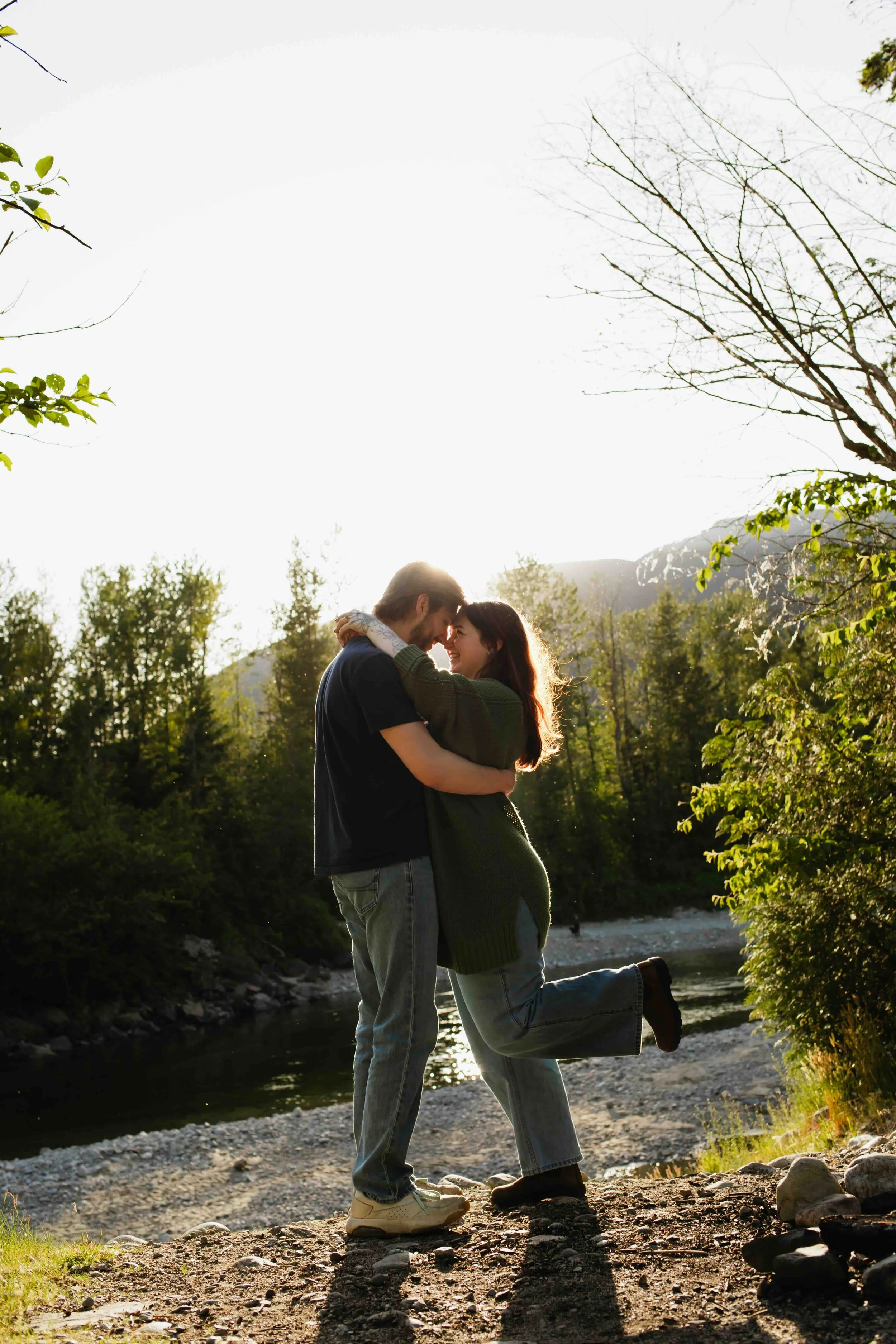 Vancouver couple slow dance and heel pop with a stunning mountain sunset background.