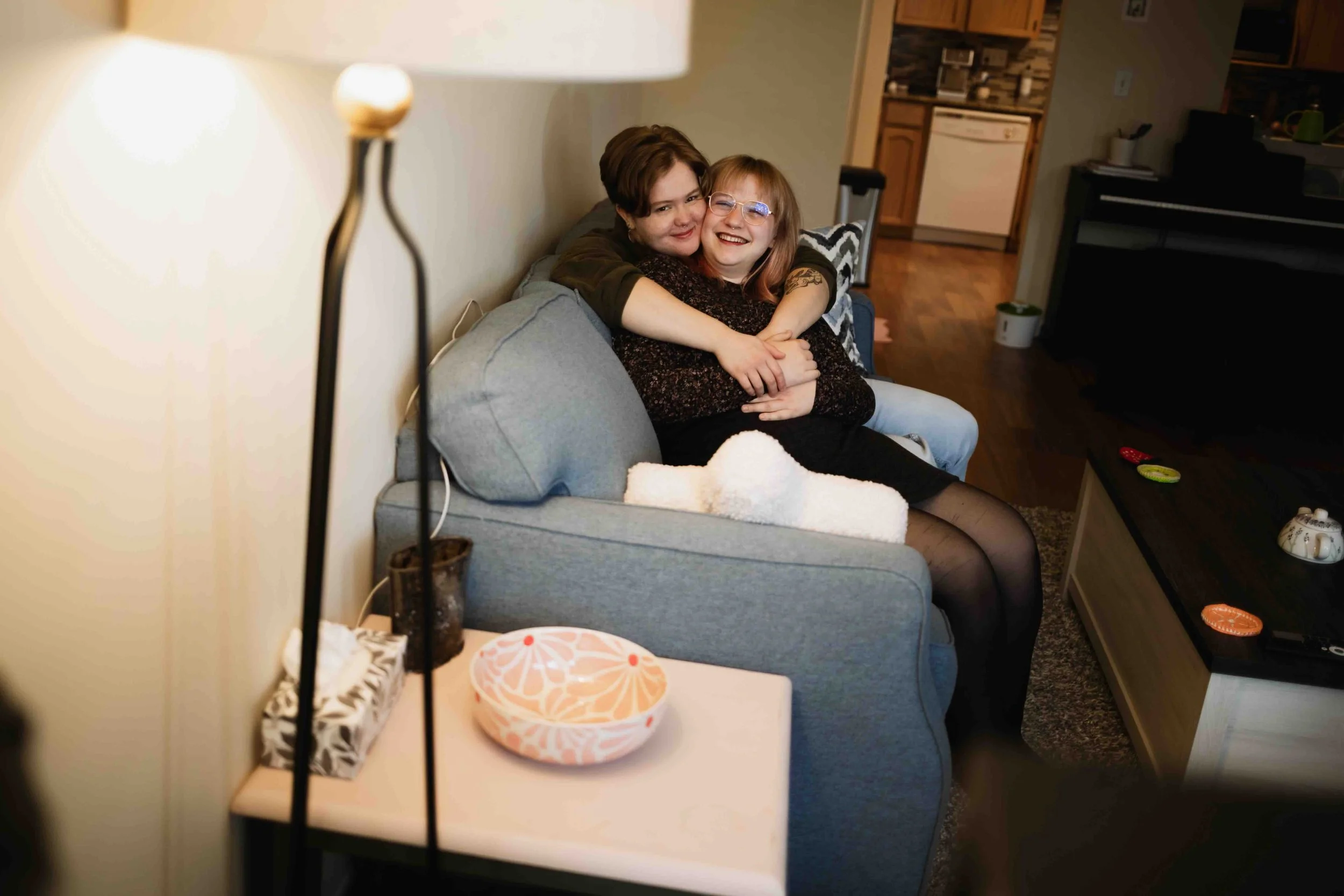 Queer Vancouver couple cozy couch cuddles
