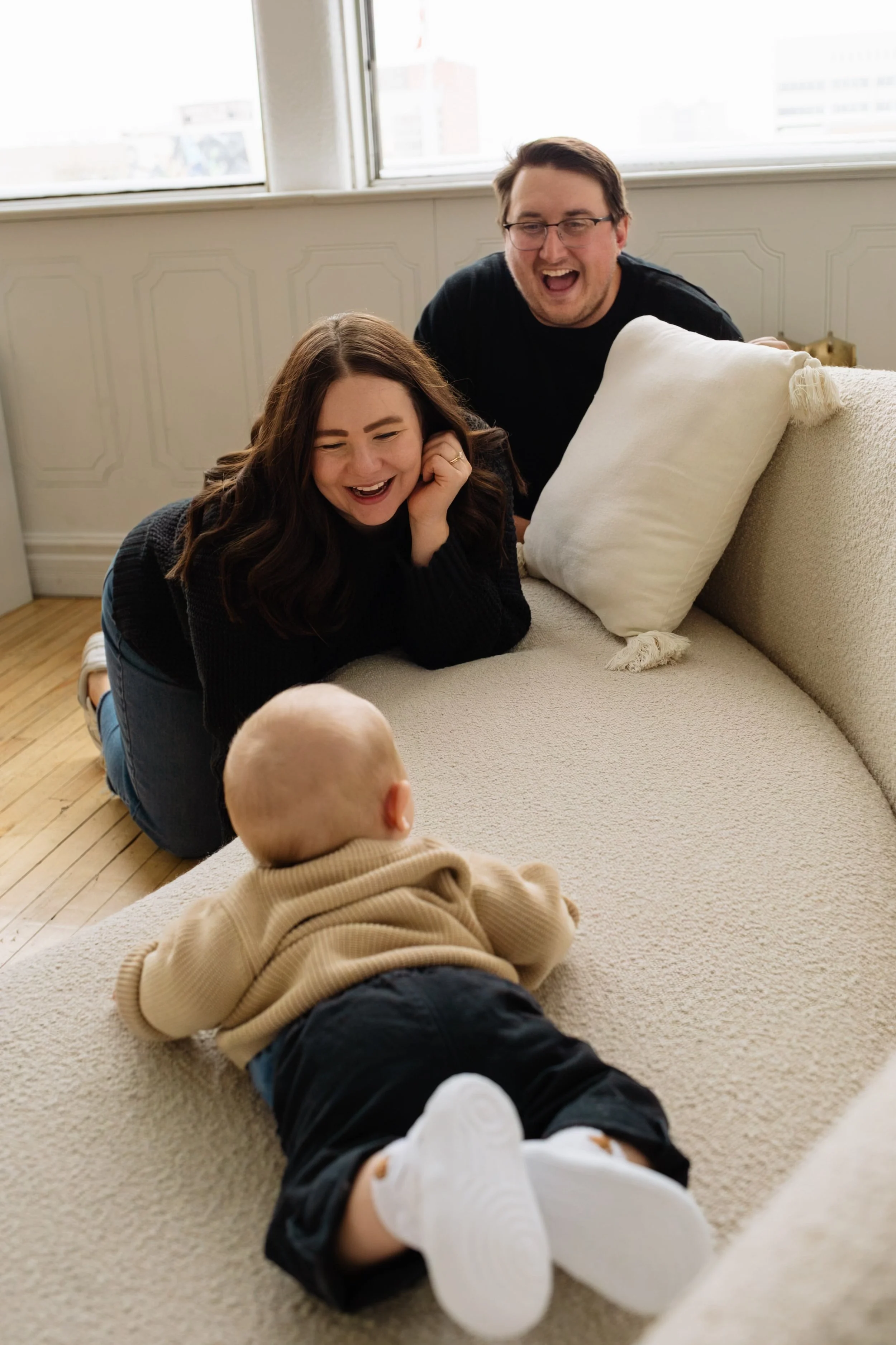 Vancouver parents joyfully smile at newborn baby