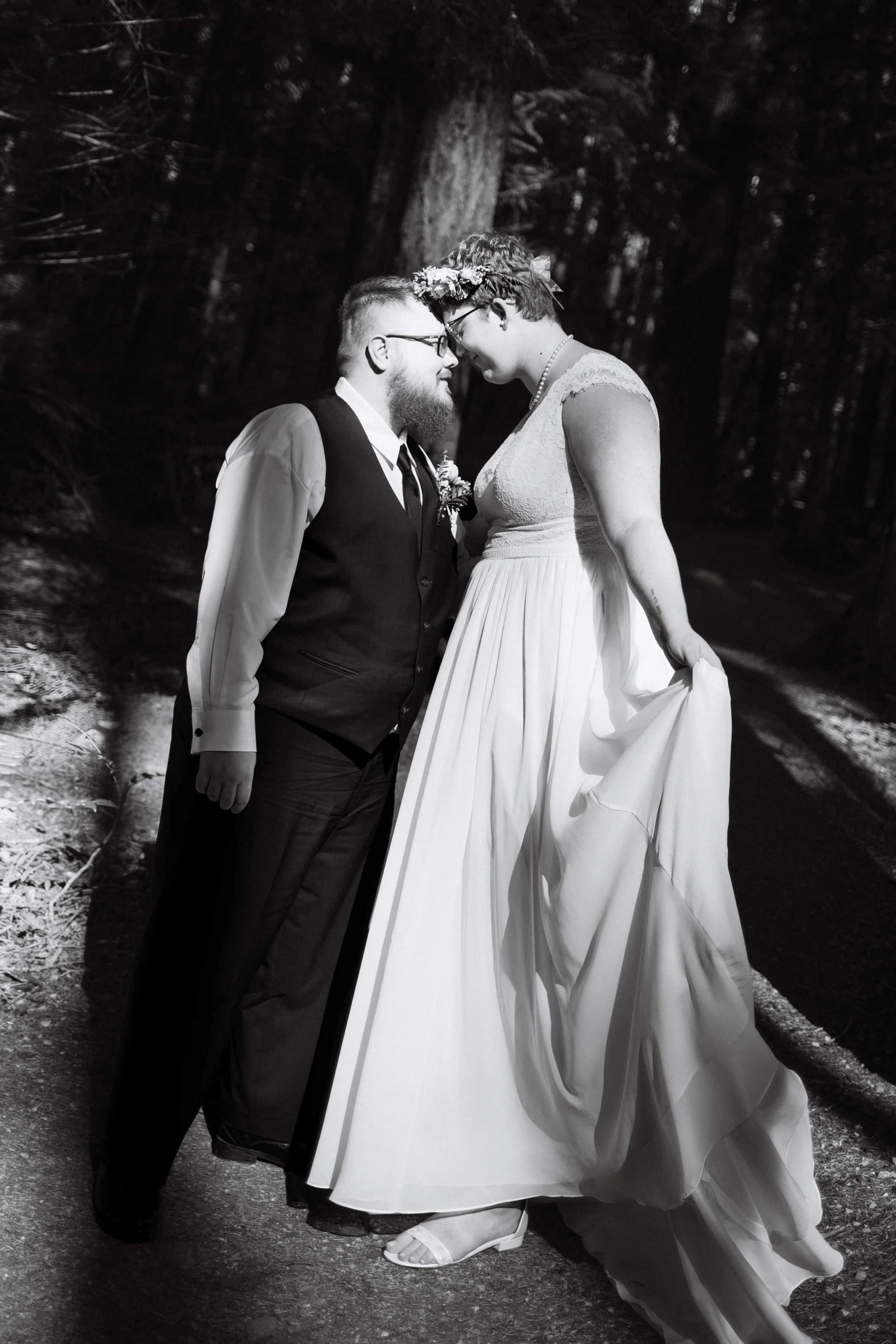Queer Vancouver couple posing elegantly for elopement photos in black in white