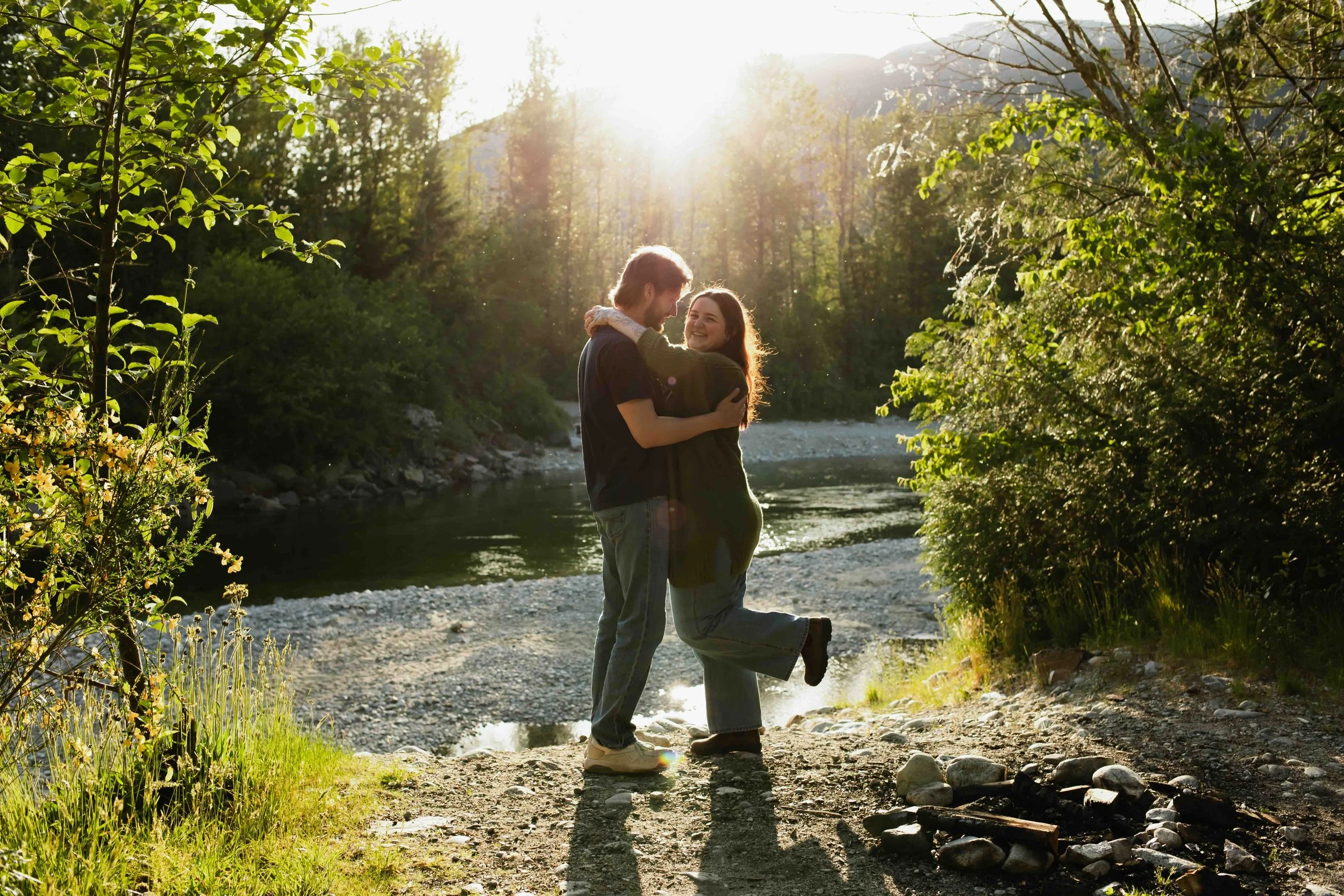 Vancouver couple poses at scenic outdoor Vancouver backdrop with mountain