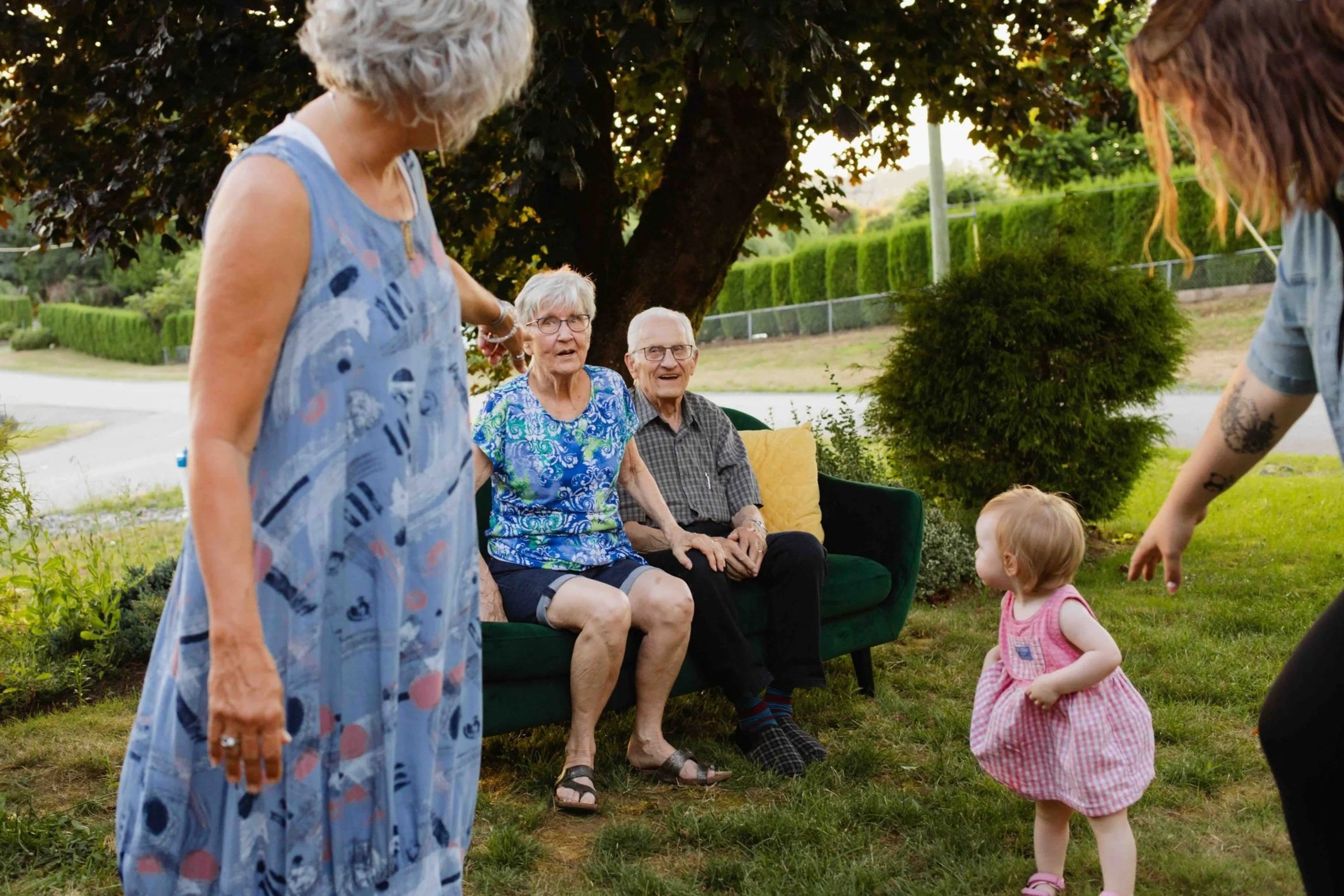 Grandparents, parents, and grandkids interacting at a Vancouver family photo session