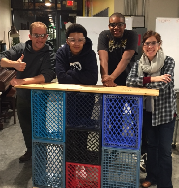 Students and volunteers building the CENTER's zero-wast coffee cart in partnership with Trash for Peace.