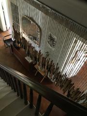 Piano keys strung next to the staircase