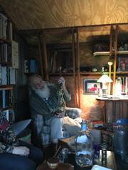 Robert with a tequila bottle in the tree house.
