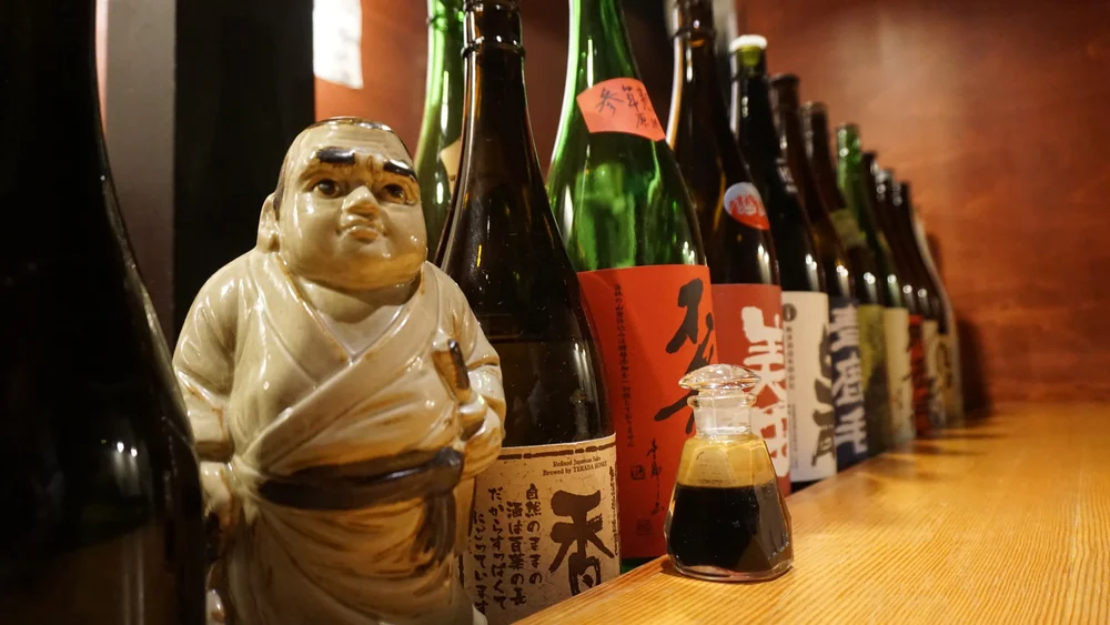 Samurai standing sentry over silken sake