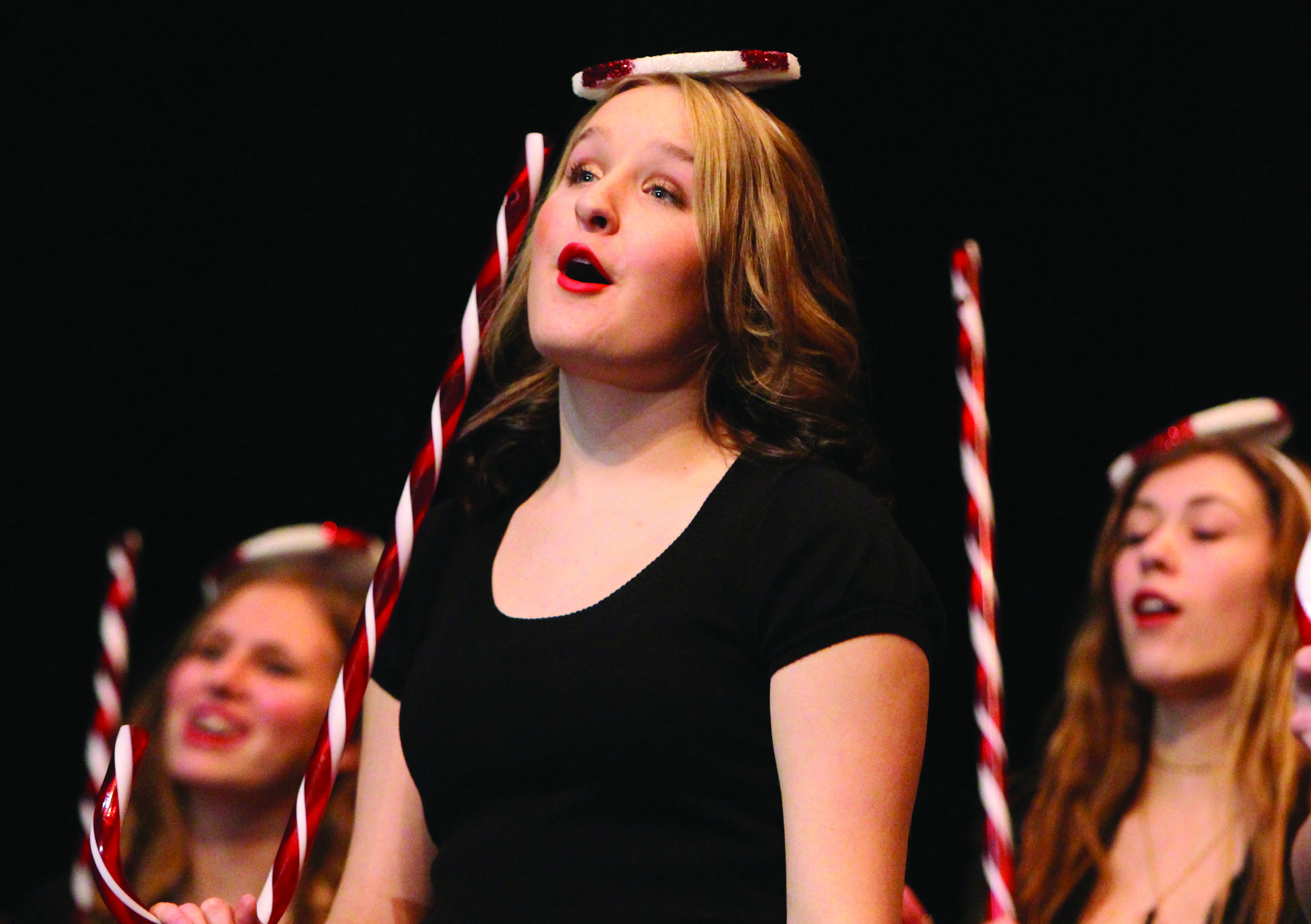 Junior Grace Foster sings “Candy Cane Lane” during the winter choir concert. “It was much different than what we’ve done in past years, but it turned out really well,” Foster said. “There were a lot of different choirs singing and singing together. As a whole, we sounded really good.”