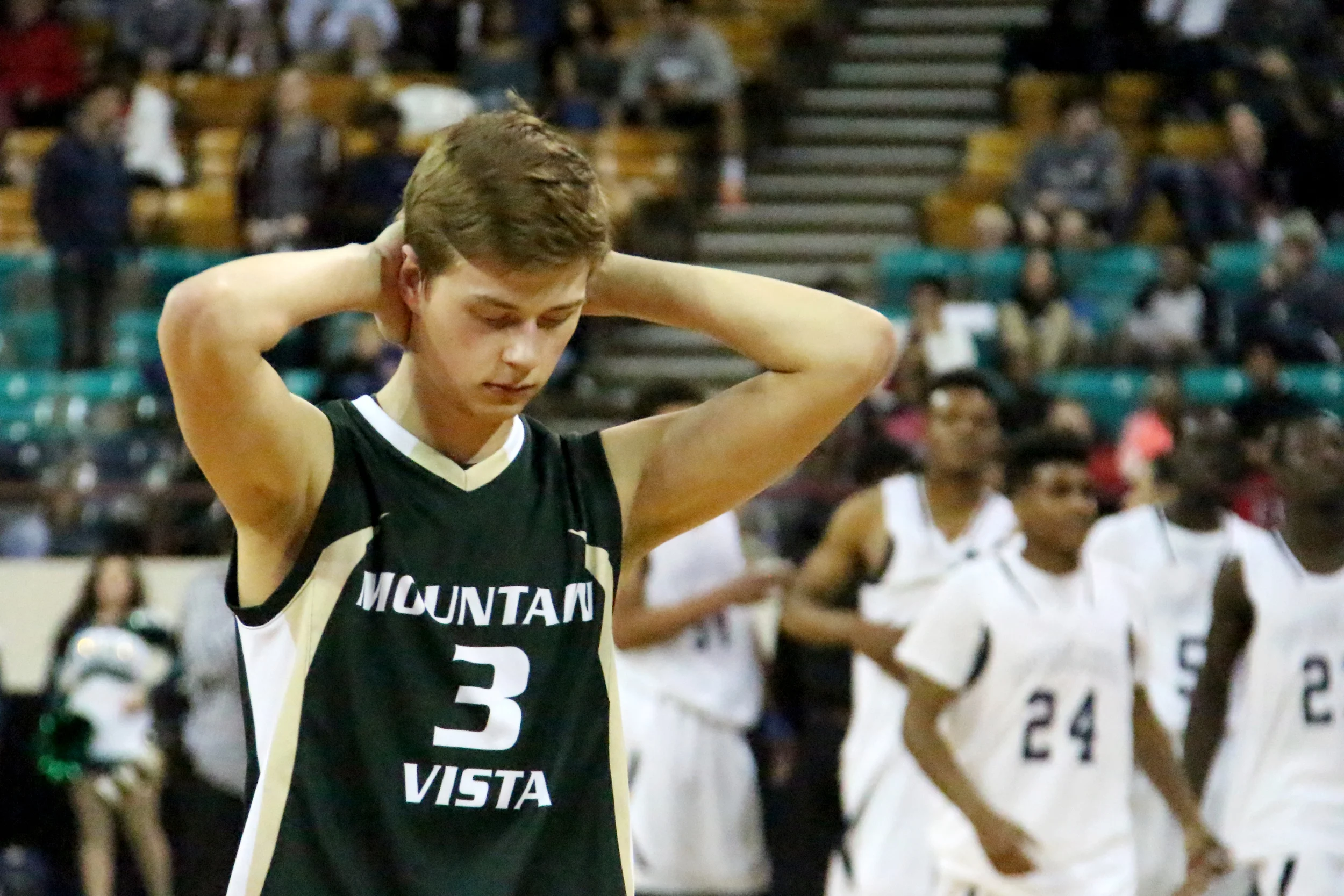 Senior Espen Thune-Larsen walks off the court following his final high school level basketball game.