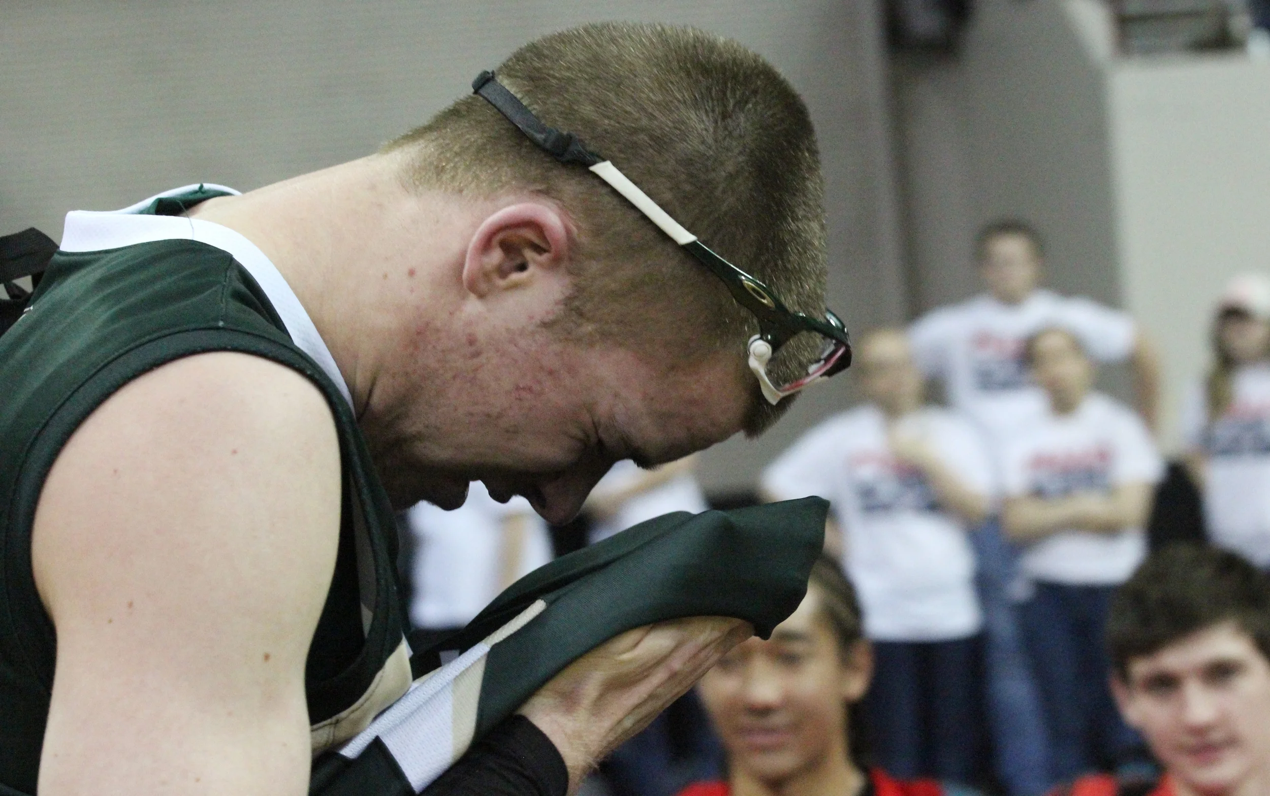 Senior Brady Subart wipes tears from his eyes after Mountain Vista fell to Overland High School in the Great Eight round of the 5A playoffs.
