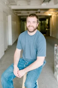 Ryan - Project Manager Ryan builds anything we need from wood for your big day - pedestals or arbors in any shape, as well as our fixer-upper-guy in our studio. He may also be one of the go-to people the day-of your wedding. His big heart leaks happiness and willingness to help in anyway!