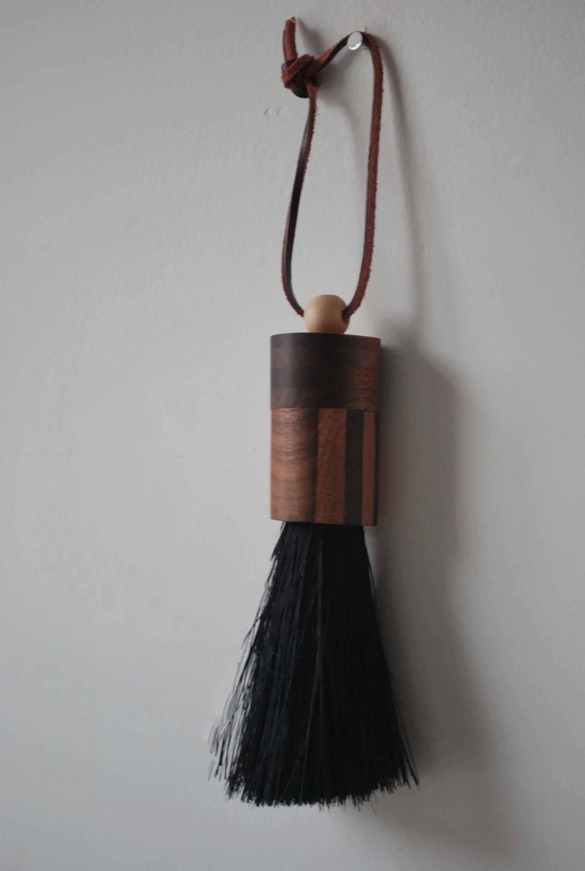 Small handmade striped brush