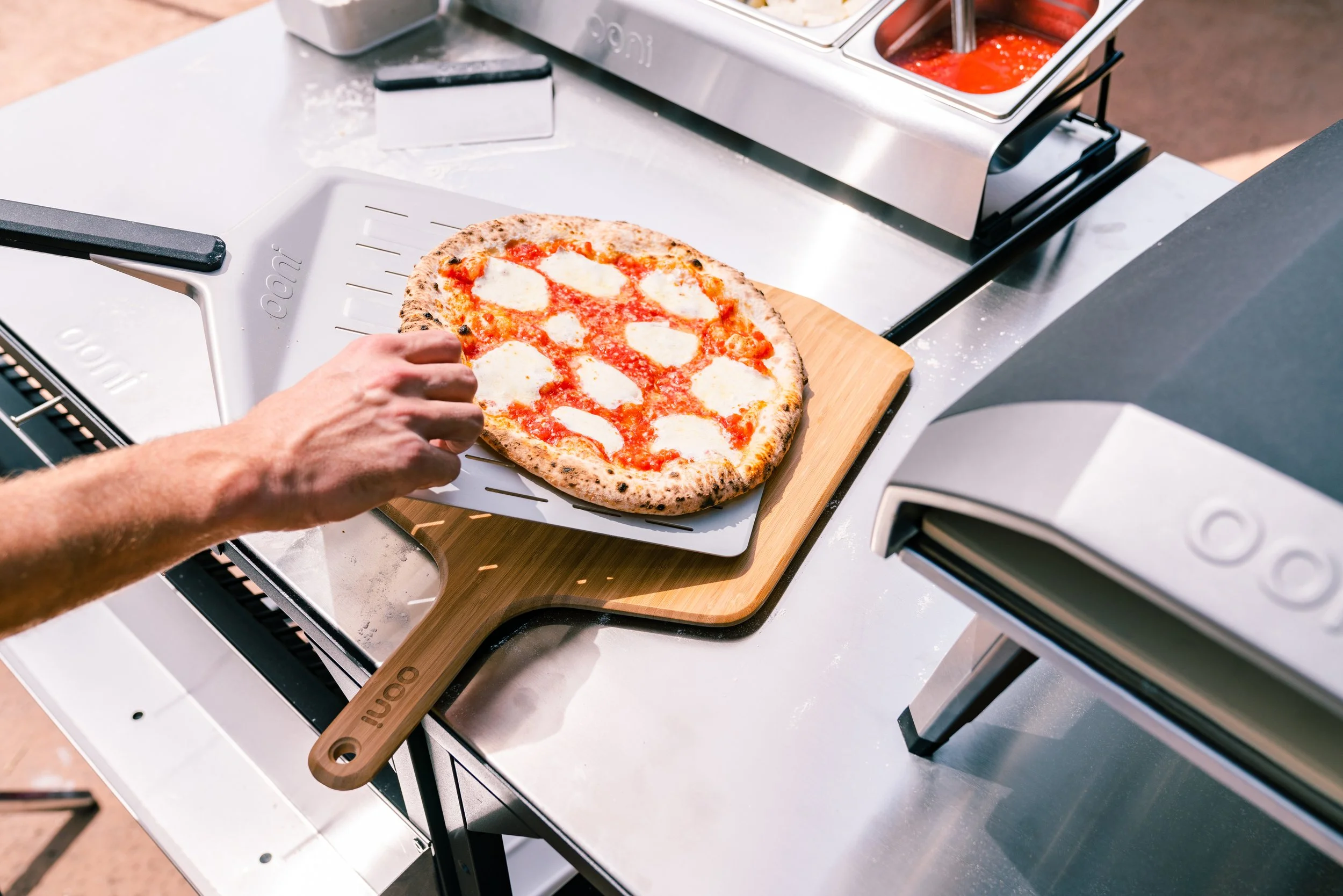 Lifestyle - Ooni Koda 16 Cook - Serving Pizza.jpg