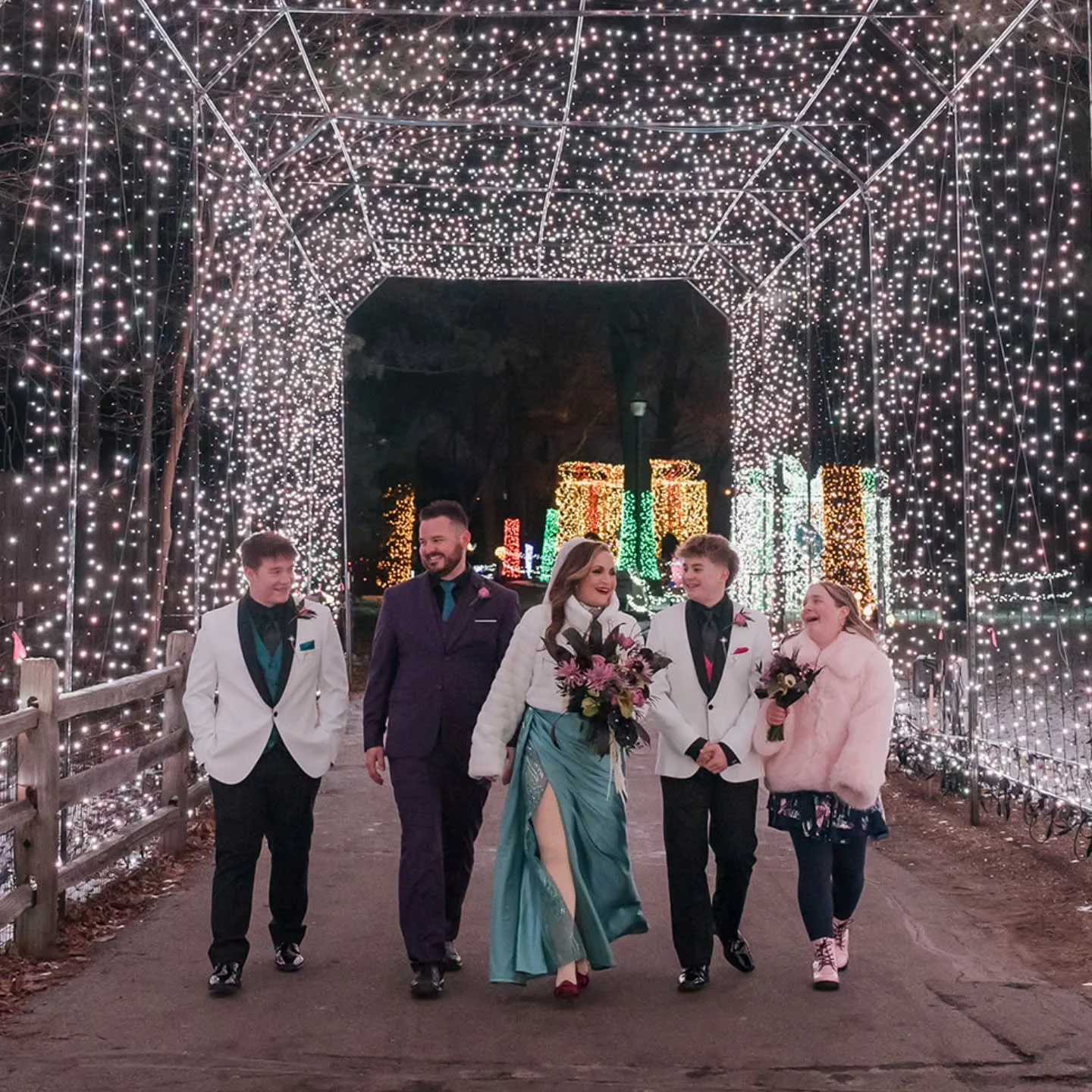 There's too many things to love about this photo...the lights, the smiles, the attire, what it represents. Is there a more magical place to say &quot;I do&quot;? Not likely. Is it ever a mistake to put your teenagers in white tuxedos? Absolutely not.