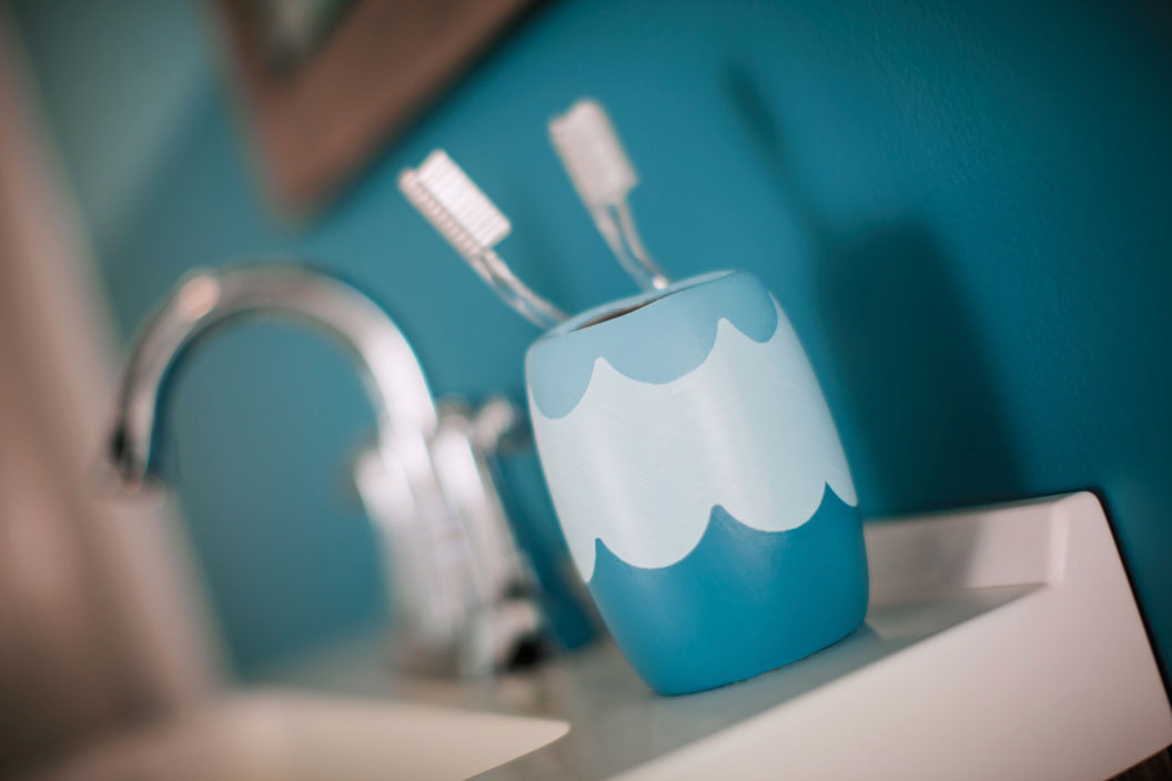 TRG image of sink with toothbrush holder. 