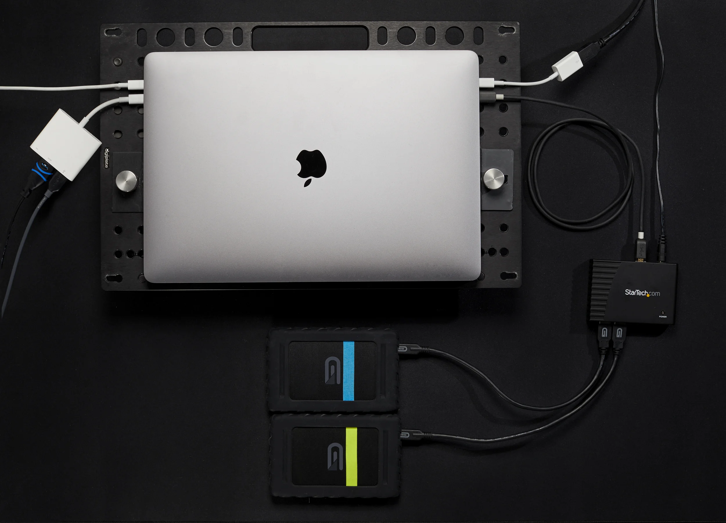 My most common dongle setup includes one Apple Multiport Digital AV Adapter, one USB-C to A adapter, and a 4 port USB-A hub with USB-C to B cable (no adapter).