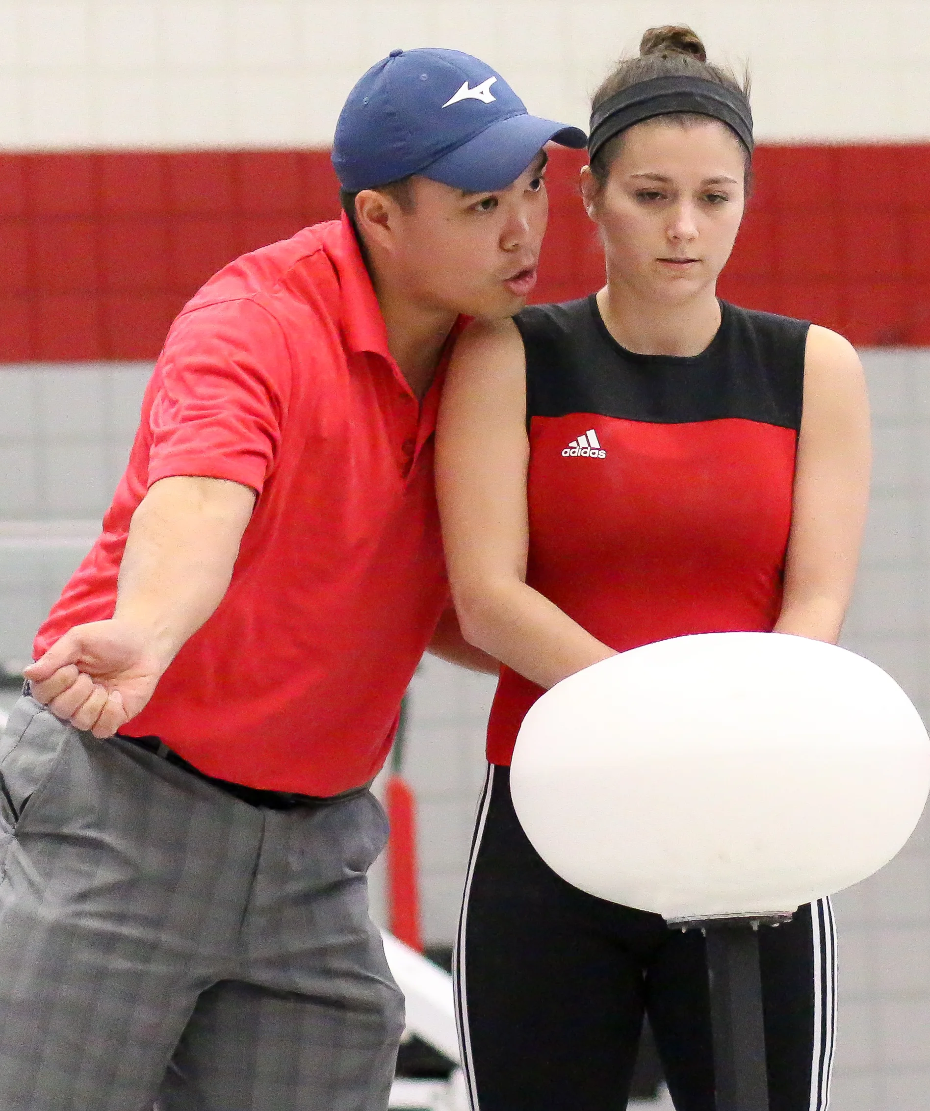 Coach Joel Quintong: Coaching his athlete from the SHU Club Weightlifting Team . The club represents Sacred Heart University , in the sport of Olympic-Style Weightlifting. 