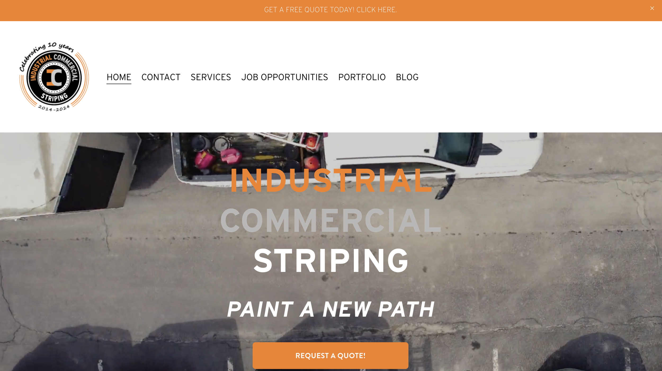 Website homepage for industrial commercial striping with an aerial view of a parking lot, a white truck filled with tools, and the company logo on the top left corner.