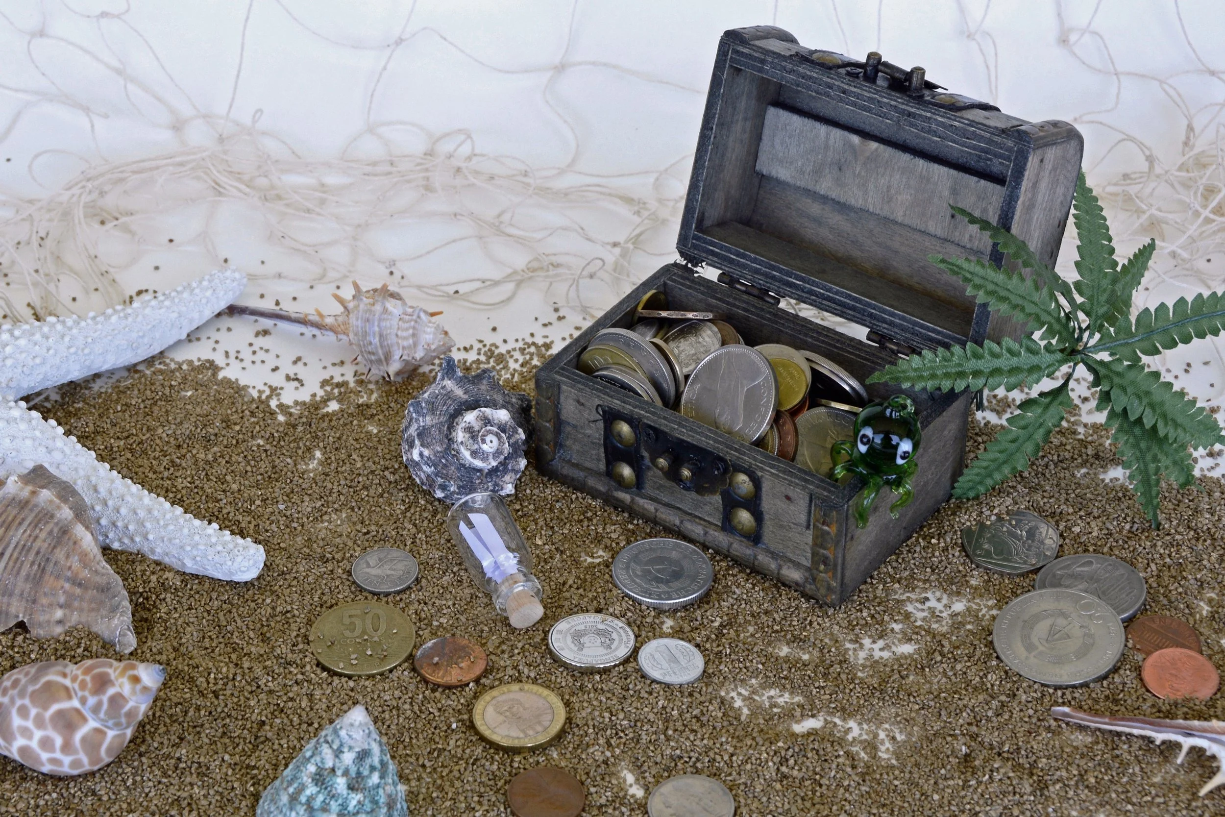 Treasure chest coins beach.jpg