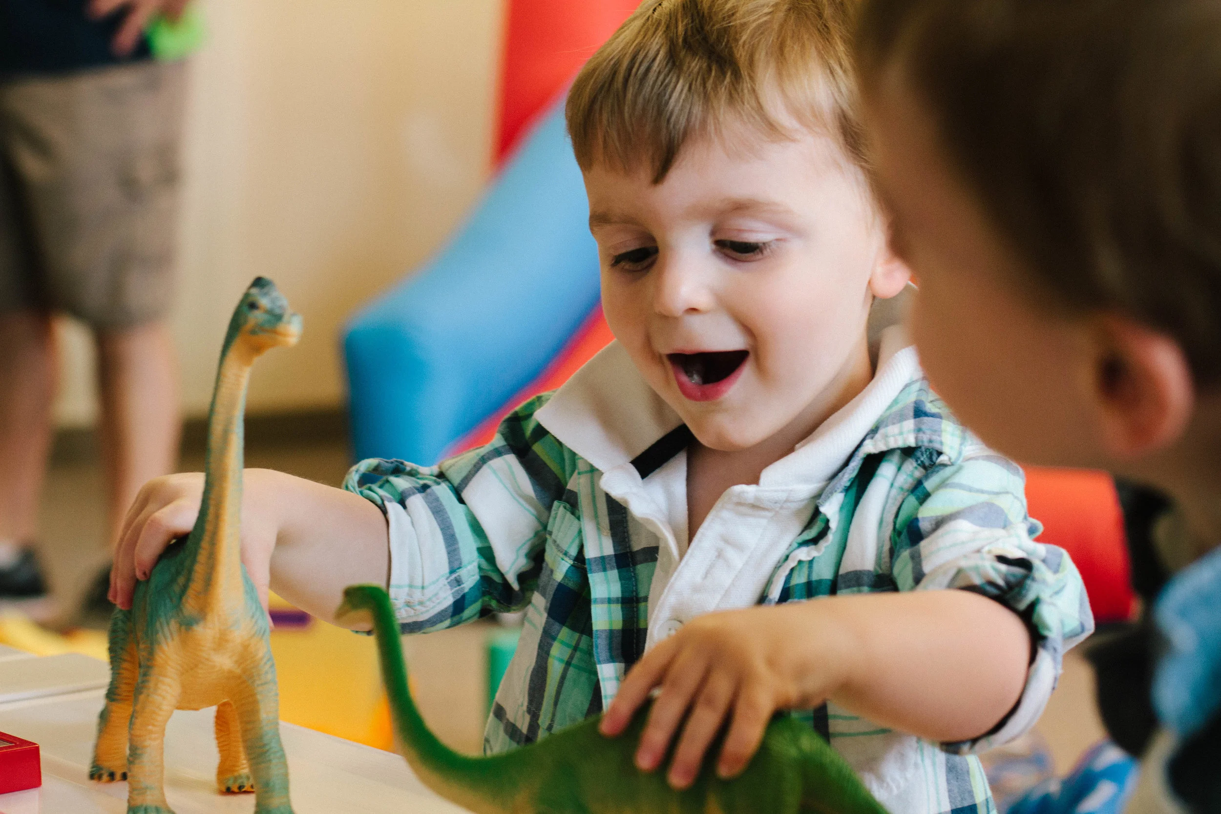 Young boy with dinosaurs.jpg