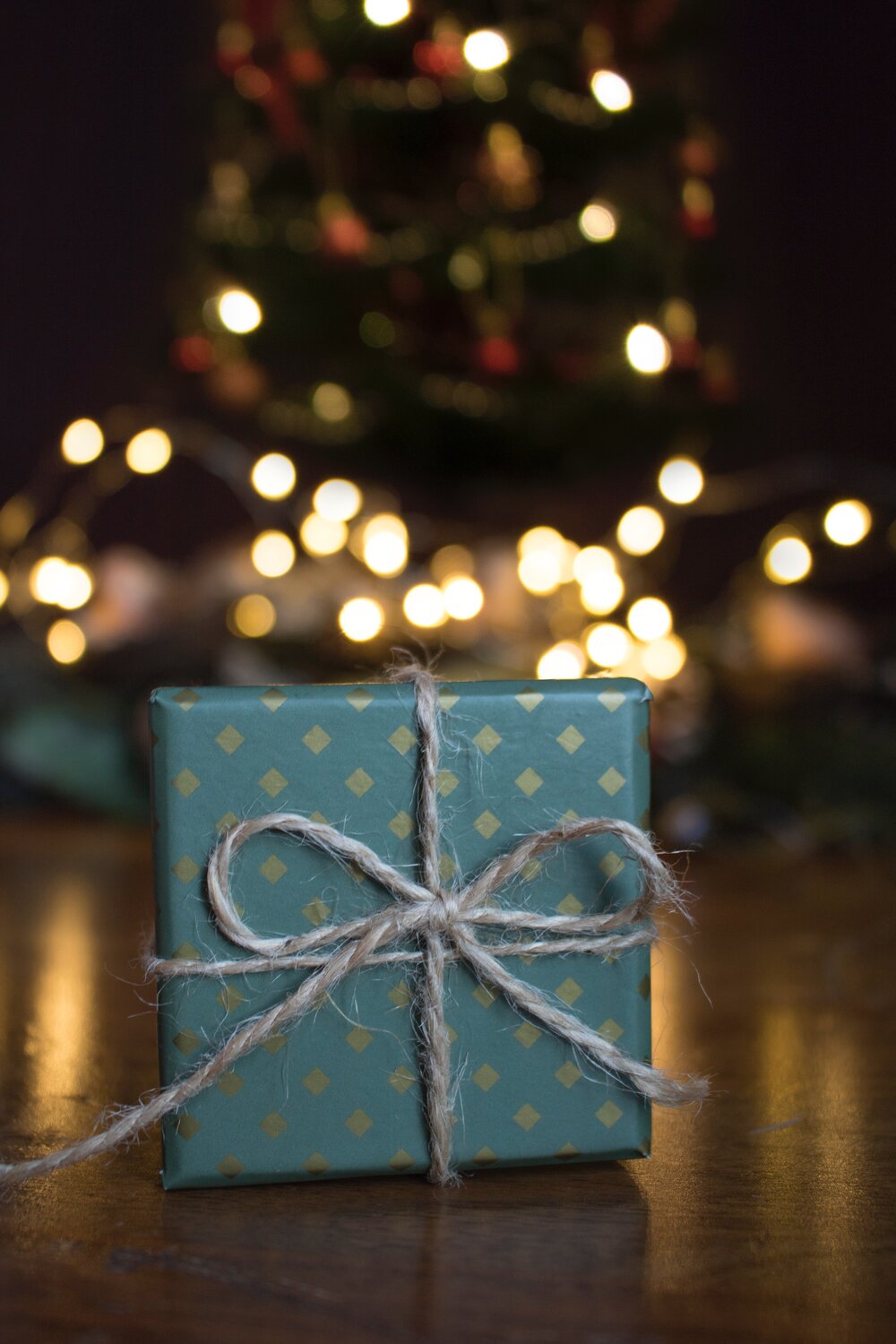 close-up-photo-of-green-gift-box-on-brown-wooden-surface-1681147.jpg