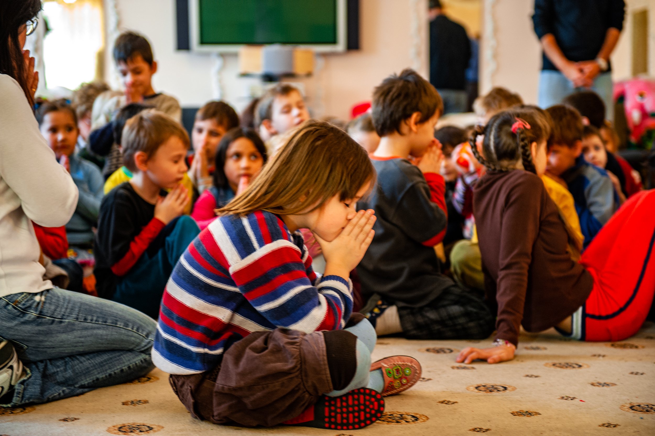 Ukrainian orphanage, children praying