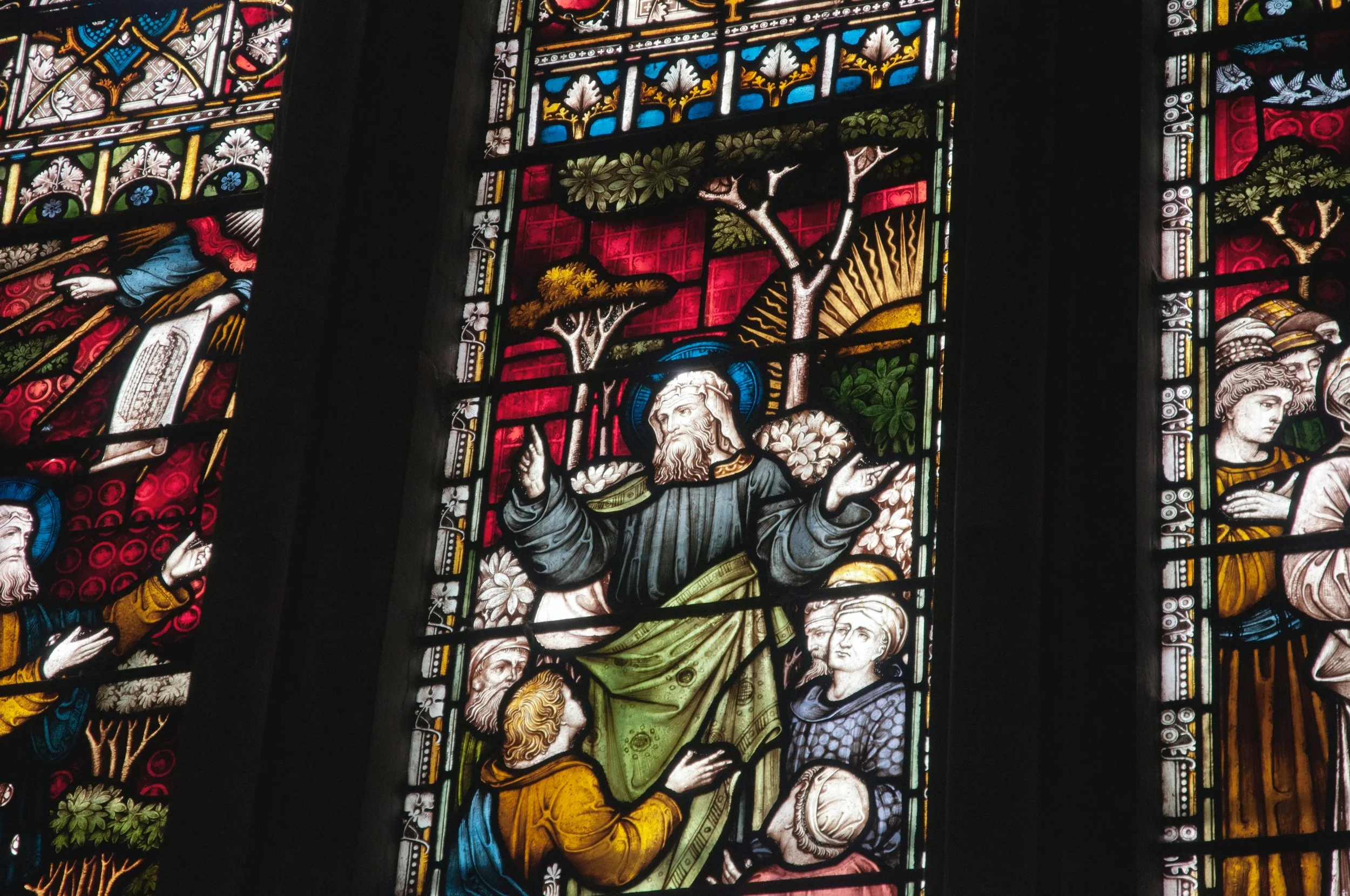 Stained glass window of Jesus teaching His disciples.