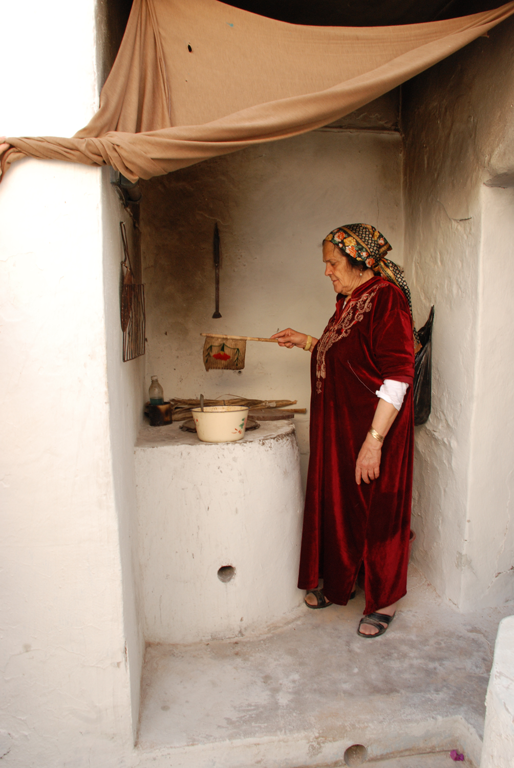 Fanning the Fire-  Hara Seghira, Djerba, Tunisia