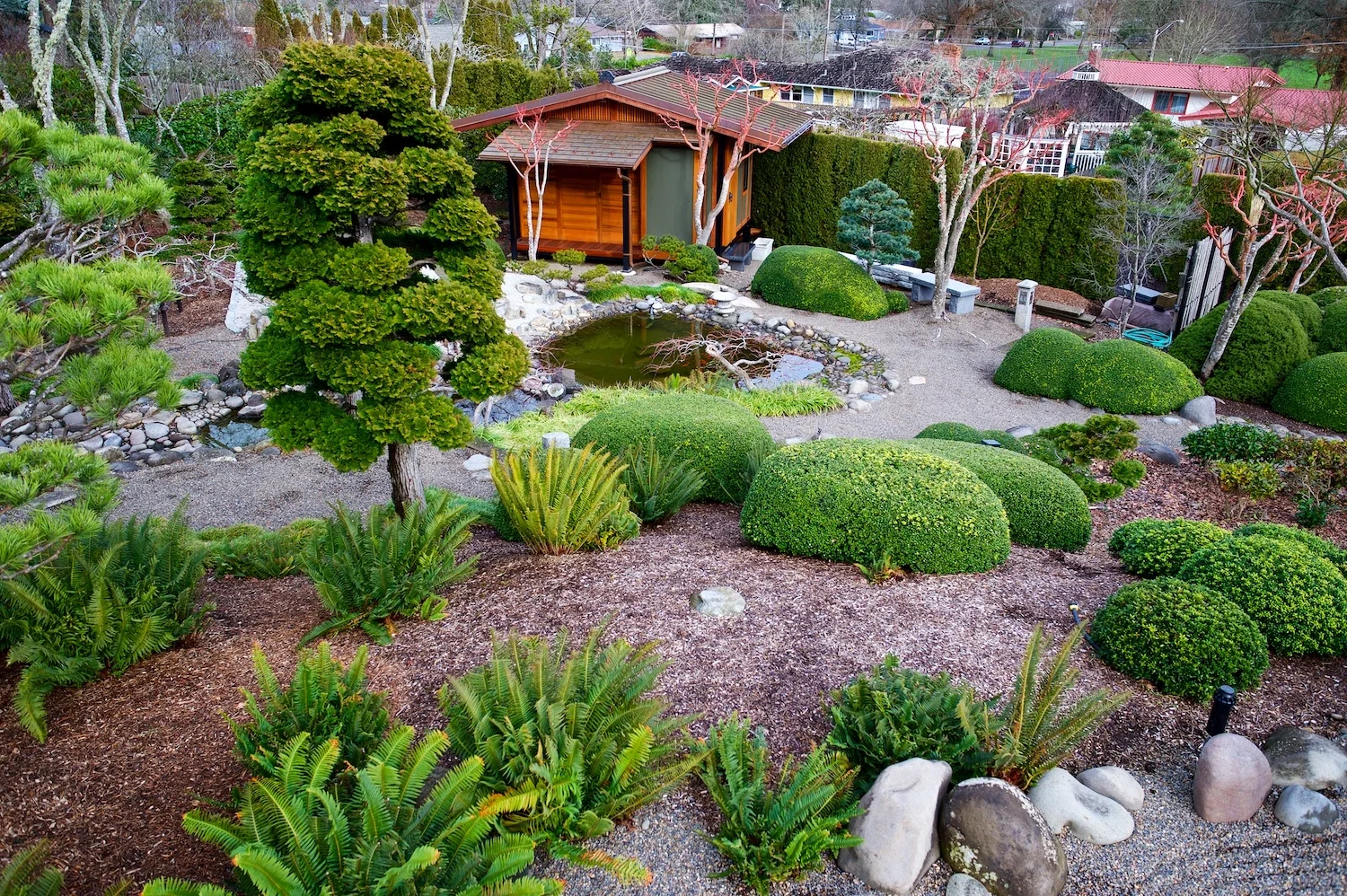 A view similar to above, but present day. Tea House replaces apple trees; Schmidt home and Cloverland Park are visible in the background.