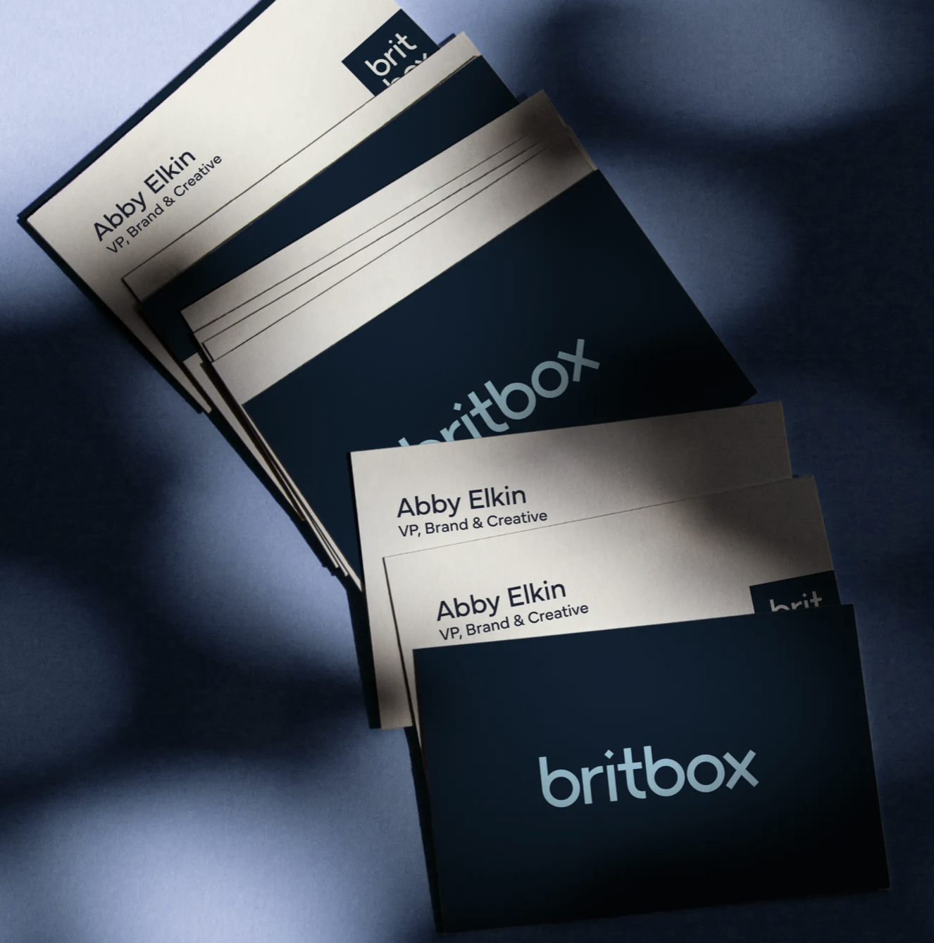 Britbox business cards in dramatic lighting