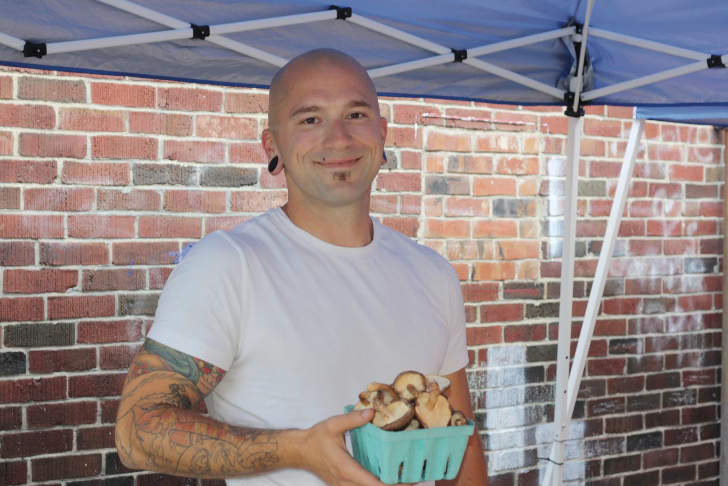  Nick Lemay, Greenfield Community College intern with mushrooms from New England Wild Edibles