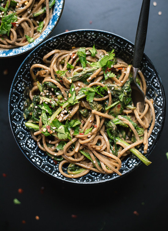 INGREDIENTS Soba and broccoli rabe 6 ounces soba noodles or whole grain spaghetti 1 pound broccoli rabe 2 tablespoons extra-virgin olive oil Salt Peanut sauce ½ cup creamy peanut butter ¼ cup reduced sodium tamari or reduced-sodium soy sauce 3 tablespoons rice vinegar 3 tablespoons water 2 tablespoons honey or agave nectar 1 teaspoon grated fresh ginger 2 cloves garlic, pressed or minced ¼ teaspoon red pepper flakes, plus more for sprinkling Garnishes Small handful chopped fresh cilantro 1 small lime wedge ½ teaspoon sesame seeds INSTRUCTIONS Prepare the broccoli rabe by rinsing it well and patting it dry. Slice off the tough lower ends of the stems and discard. Slice off any remaining stems that are over ¼-inch in diameter and discard those as well, since they will be too fibrous even after cooking. Next, prepare the peanut sauce. In a 2-cup liquid measuring cup, whisk together the ingredients until well blended. Set aside. Bring a large pot of salted water to boil. Meanwhile, warm 2 tablespoons olive oil in a large skillet over medium heat. Add the broccoli rabe and season with a dash of salt and a small pinch of red pepper flakes. Toss to combine and continue cooking, stirring occasionally, until the leaves have wilted and the stems are easily pierced by a fork, about 8 minutes. Remove from heat. Once the water is boiling, add the soba noodles and cook just until al dente, about 5 minutes. Drain the noodles, then return them to the pot, add the broccoli rabe and toss with peanut sauce (you might not quite need all of it) until blended. Transfer to a serving bowl or individual bowls and top with a sprinkle of chopped cilantro, a small squeeze of lime juice, a sprinkle of sesame seeds and red pepper flakes, if you’d like some extra heat.