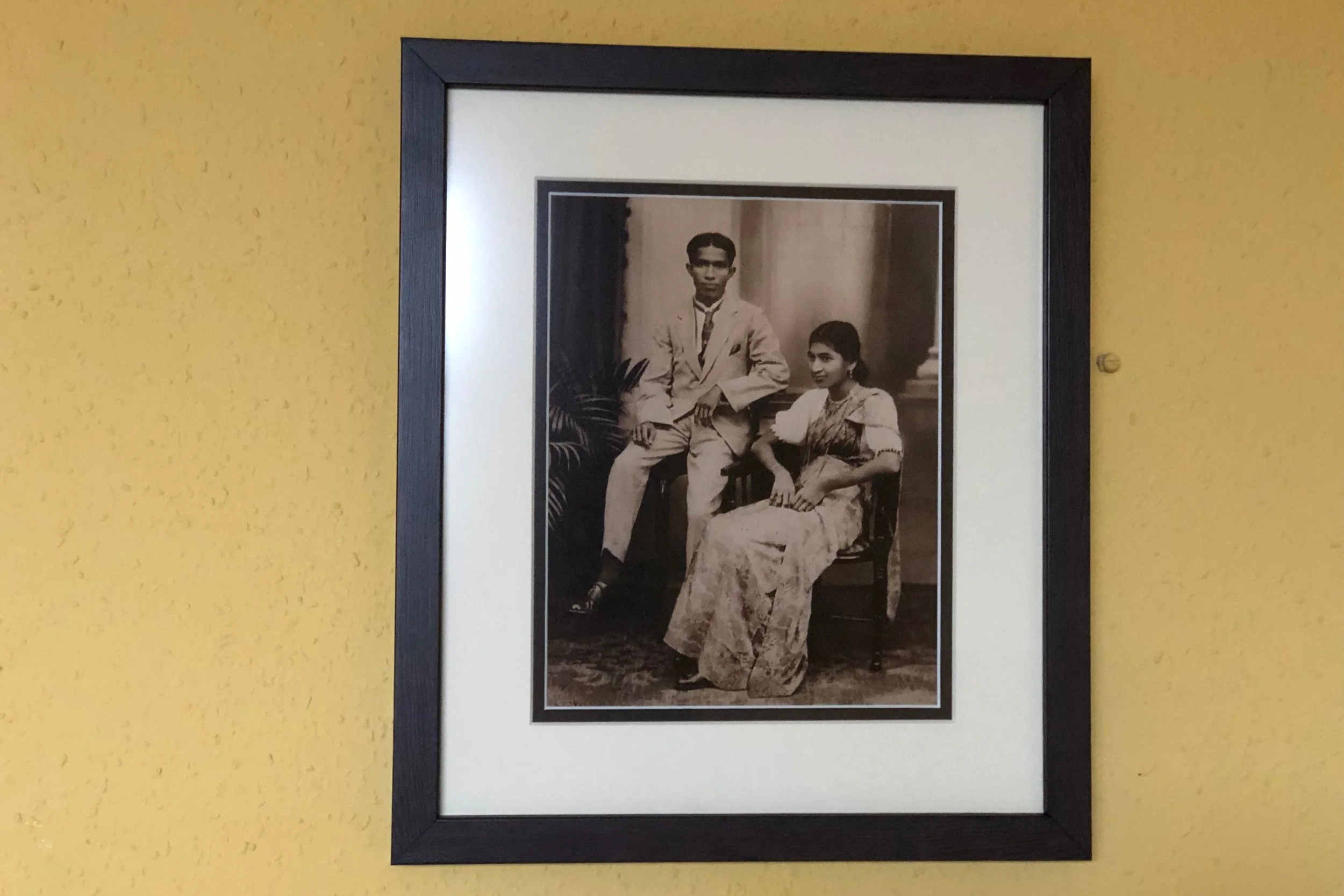 A gift for my dad: a photo of his parents framed by Mimi V Artworks. You’d never know that the print was actually a photo of a photo - through clever mounting, the team managed to lose the uneven edges that surrounded the print. Two mounts, an off-white and a dark brown with a white beveled edge are used, creating the illusion of extending the photo and adding depth.