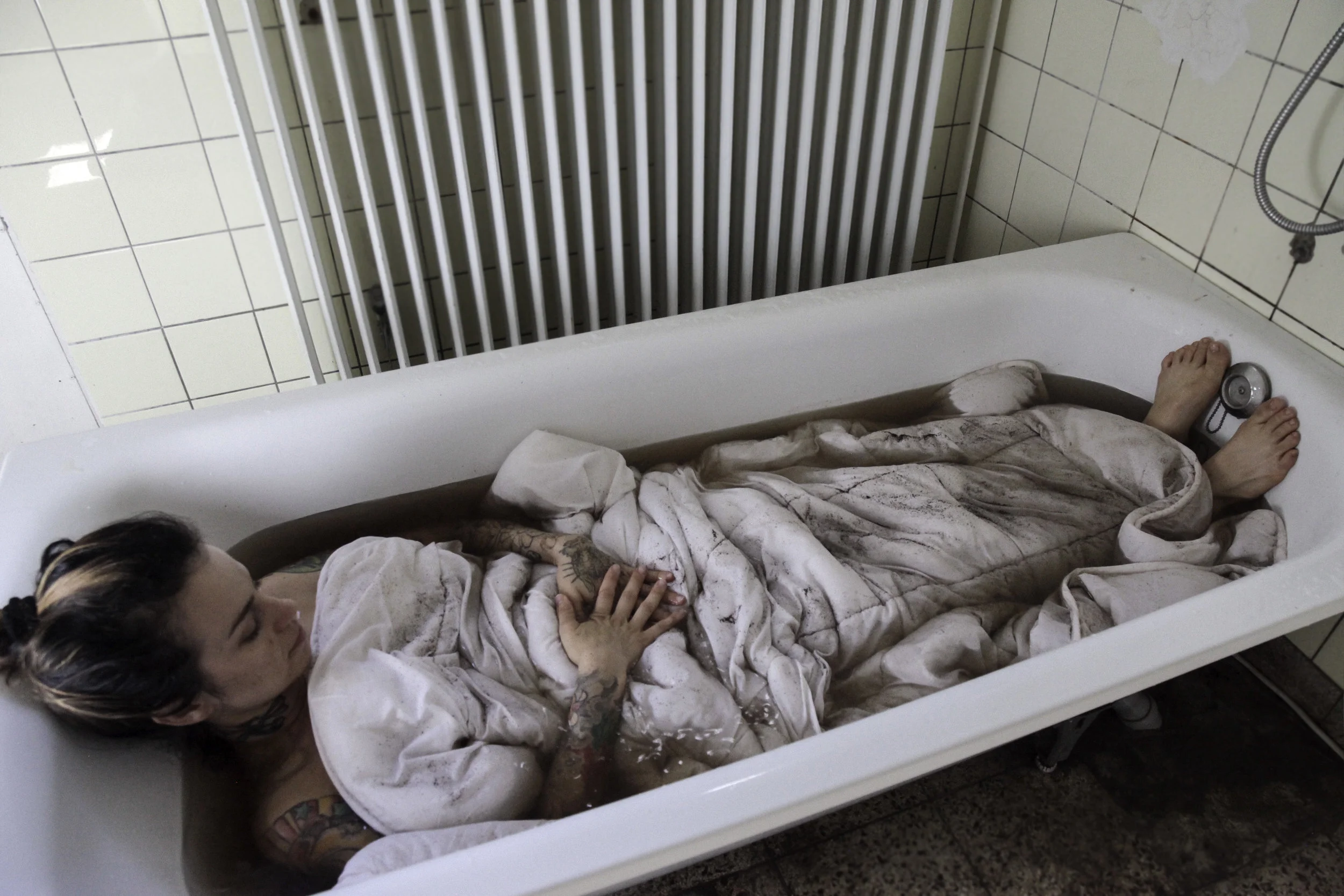 Steeping II , 2016. Performance recorded at S tiftung I nsel H ombroich in Neuss, Germany. Digital Photography, edition of 10 prints on photographic paper, 23 x 15 inches ( 59 x 39 cm).