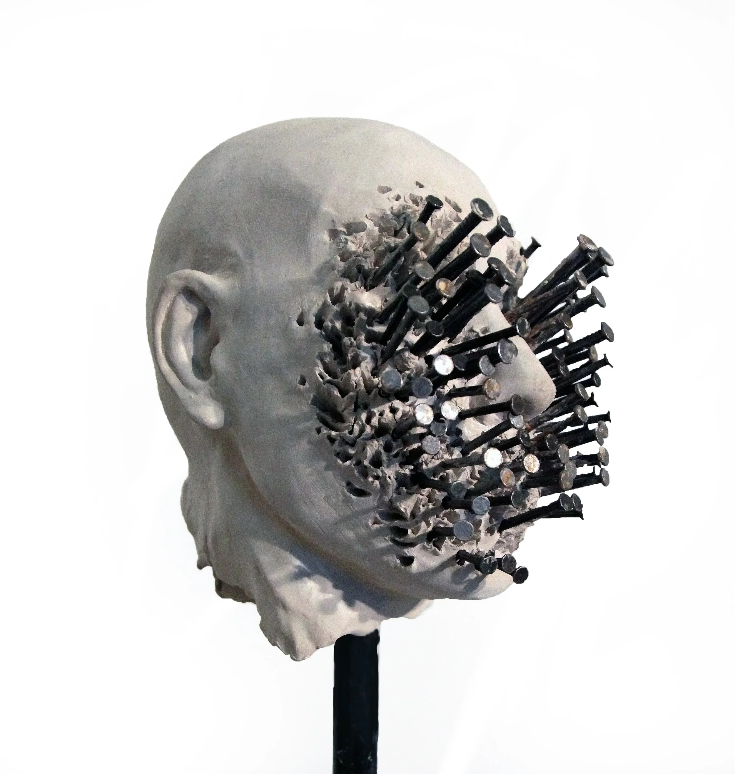 Wrong Side Feelings, 2015 . Ceramic, metal and nails on wood stand, 16 x 10 x 10 inches ( 40.64 x 25.4 x 25.4 cm).