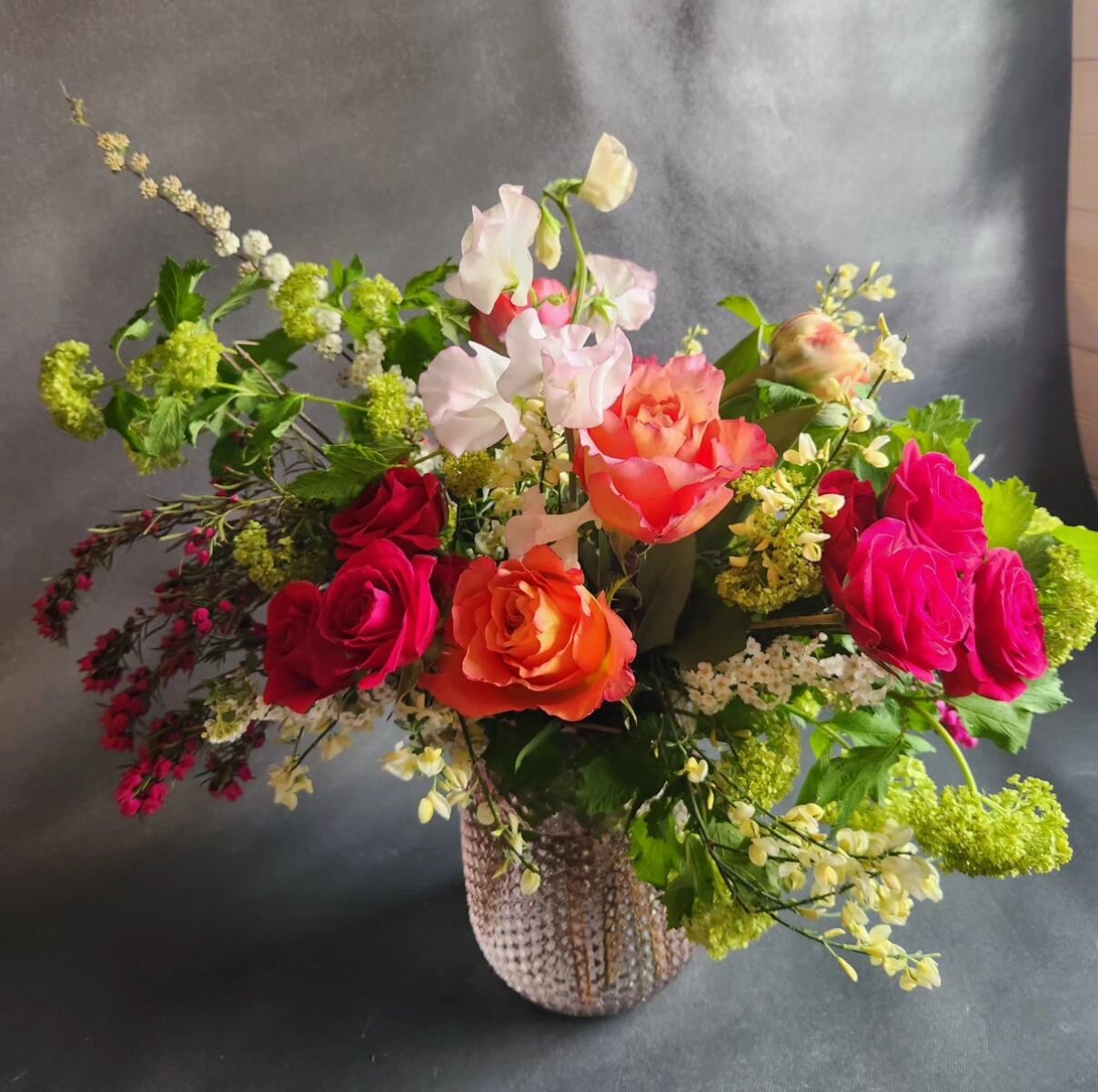 Sweetpea, roses, and blooming branches make this one perfect for Mom. Order online for delivery Tues - Sun. Pick up available as well. #mothersday #freshflowers #sweetpea #elmerflorist
