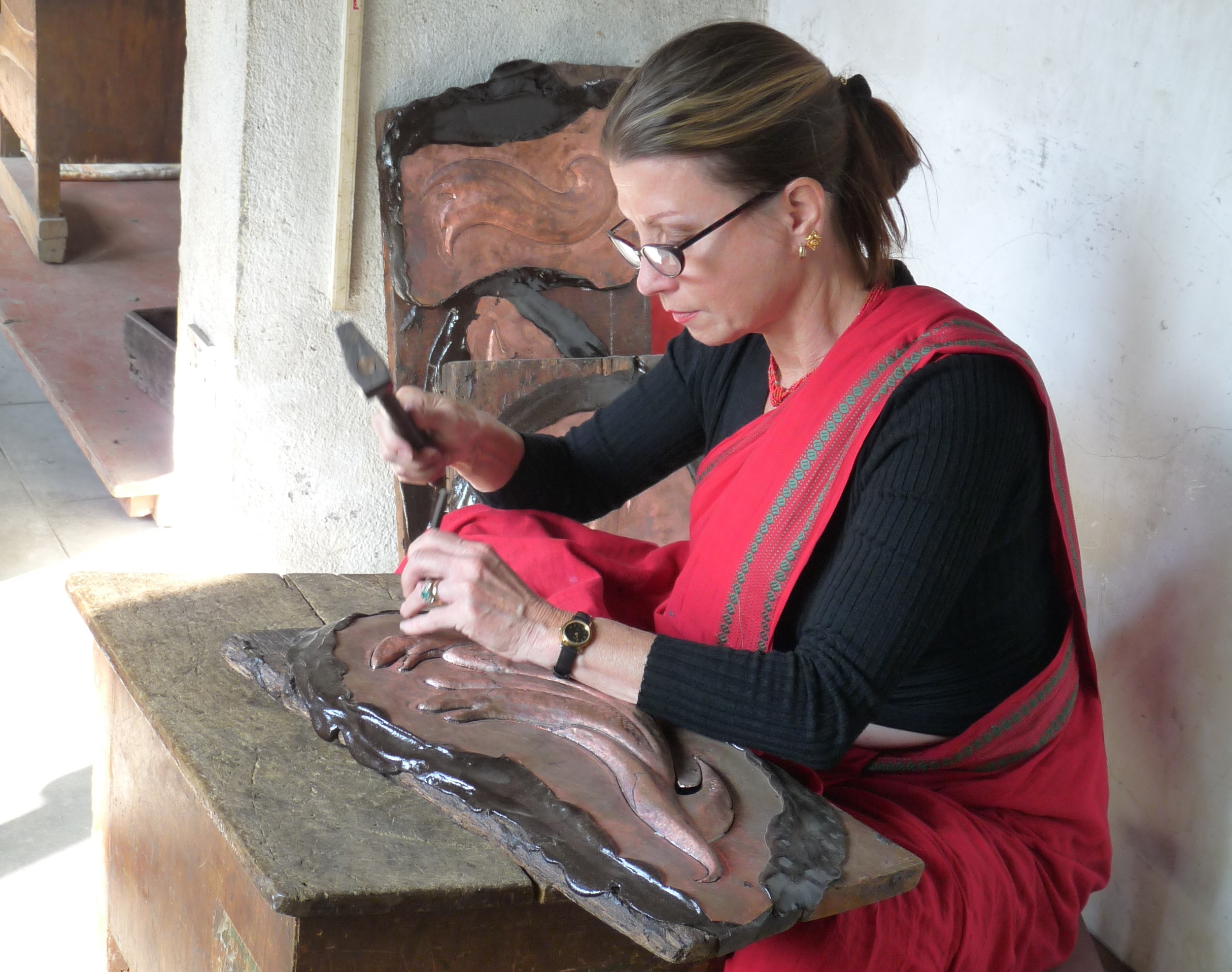 Drdak working on repoussé elements of "The Flying Nagas" in the atelier of Rabindra Shakya, Patan, 2012.