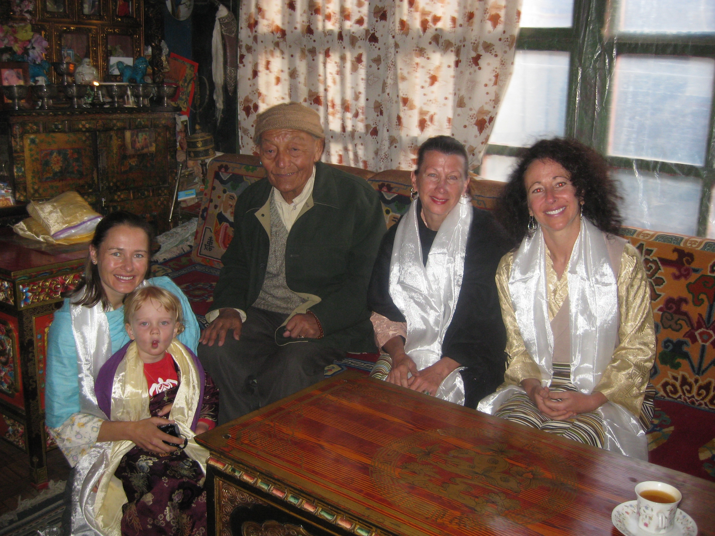L-R: Dr. Sienna Craig with daughter Aida, Jigme Palbar Bista, Raja (king) of the kingdom of Lo, visual artist Maureen Drdak and composer Dr. Andrea Clearfield in the Raja's public audience room, 2008.