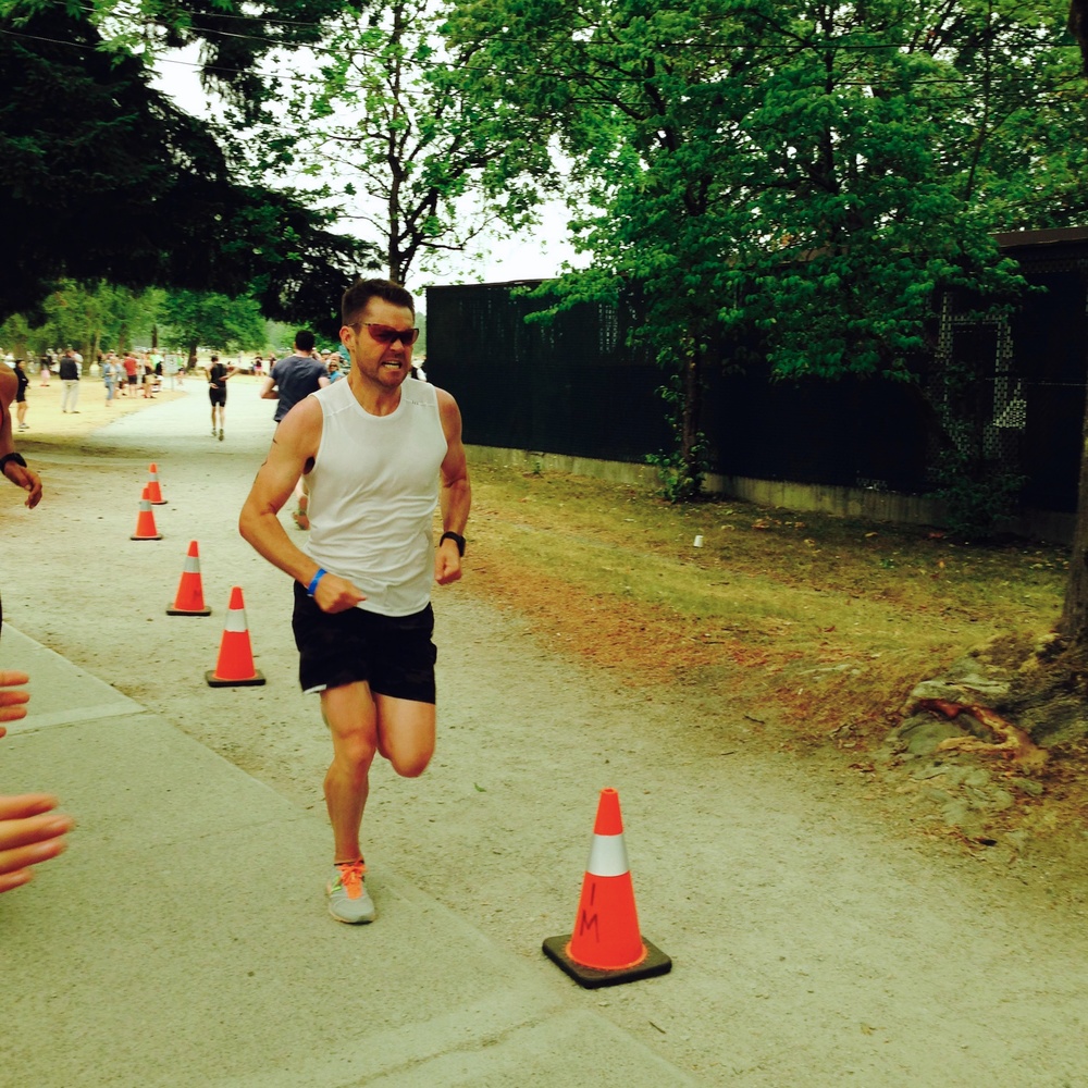 Tom running with grit at the Subaru Vancouver Triathlon