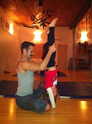 Stella and Aaron Lind work on handstands