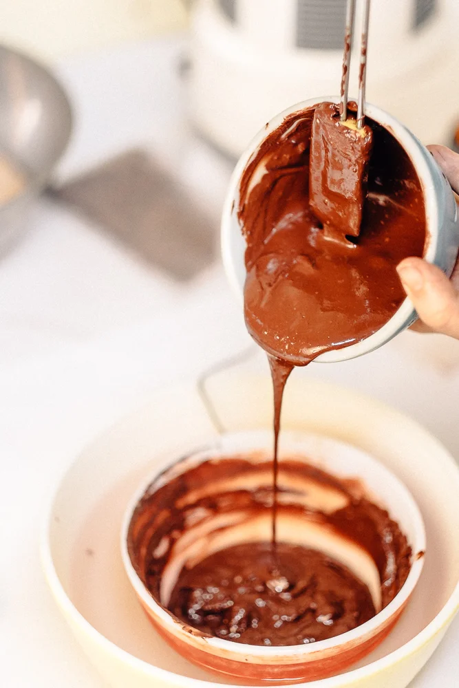 adding warm chocolate to seed chocolate