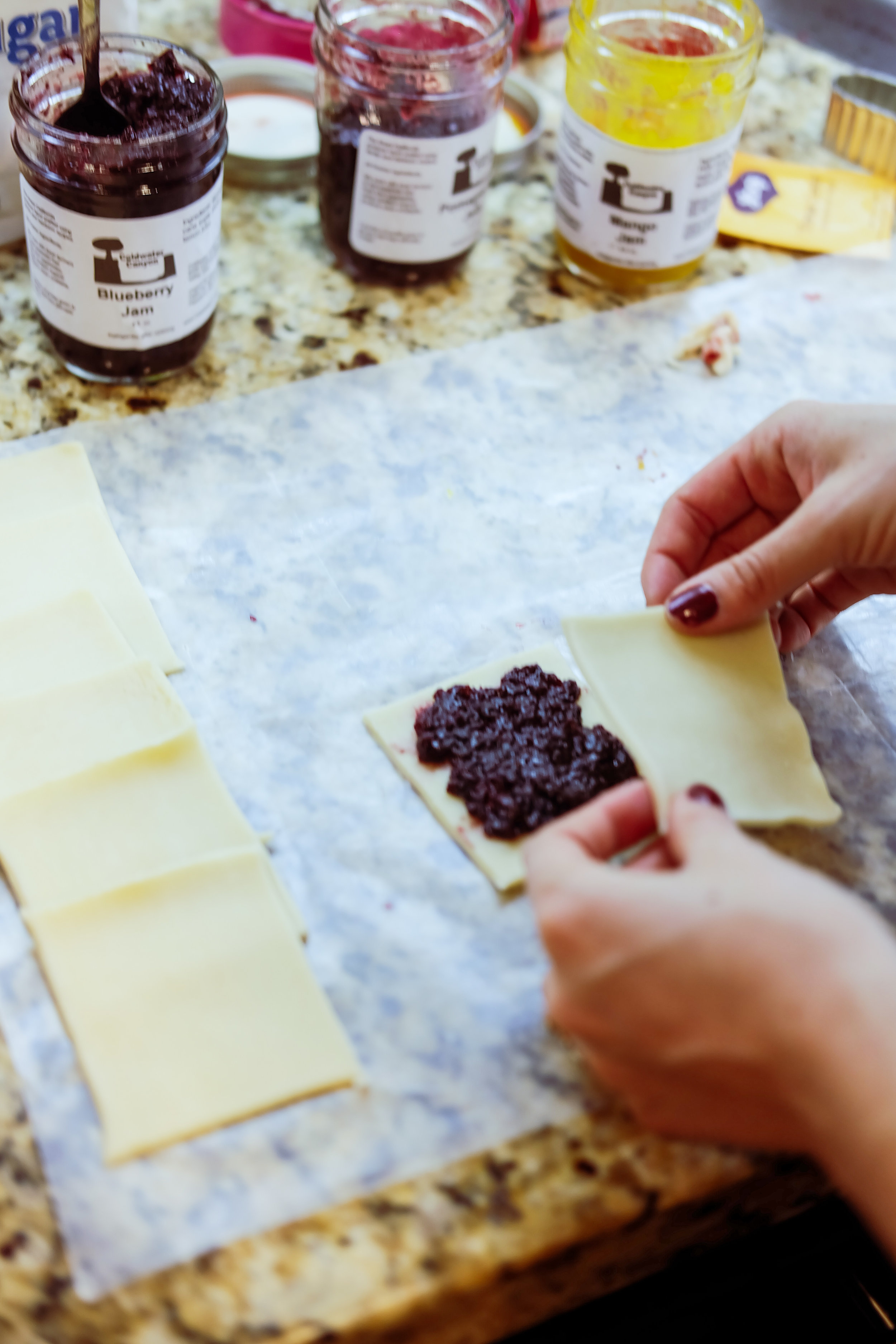 Now put your jam or jelly filling in the center of the bottom cut-outs. I like to lay out the pairs first; that way I don’t end up with too many top or bottom pieces.