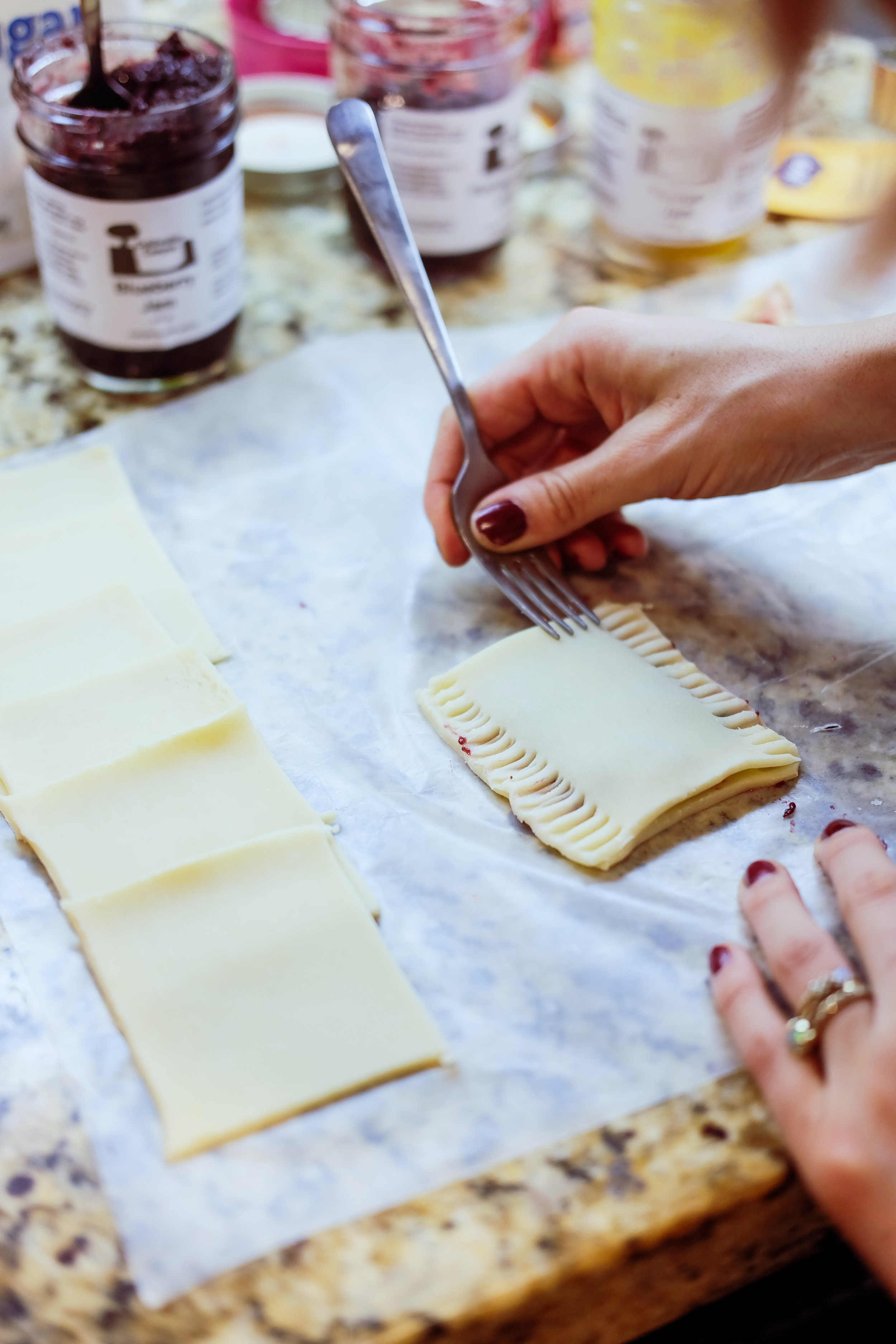 After you place the filling on the bottom piece, lay the top over it and use a fork to seal the sides. Don’t worry if it looks a mess. We’ll fix that shortly!