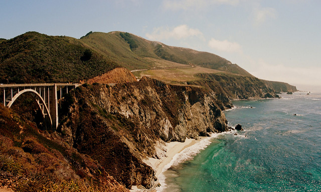 Watch the waves crash in front of the Brixby Bridge in Big Sur as you gaze longingly in your lover's eyes "click goes the camera."